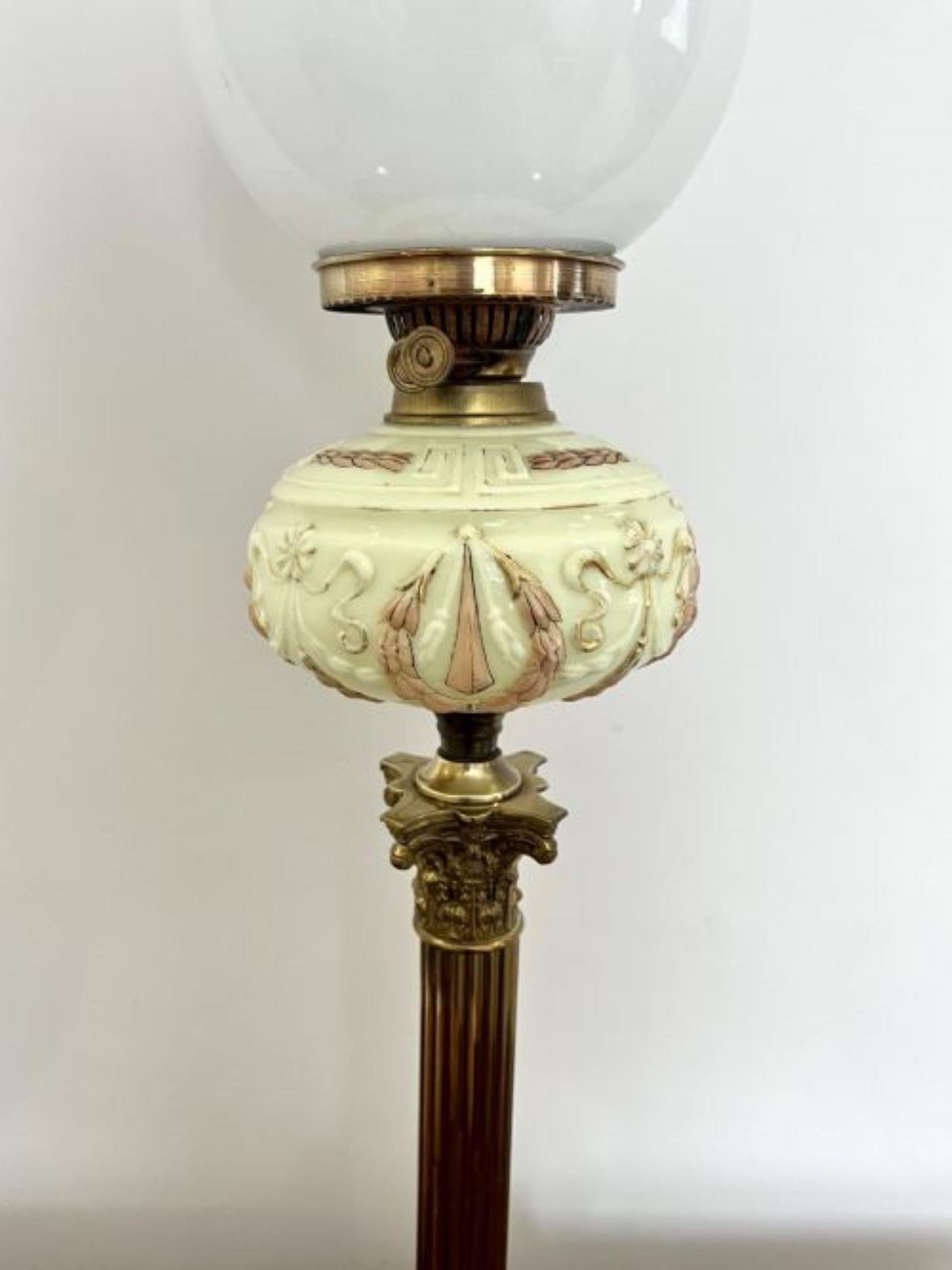 Fantastic quality large antique Victorian brass oil lamp having a quality brass oil lamp with a white glass globular shade, having a vaseline glass reservoir supported on a brass Corinthian column, raised on a square stepped brass base
