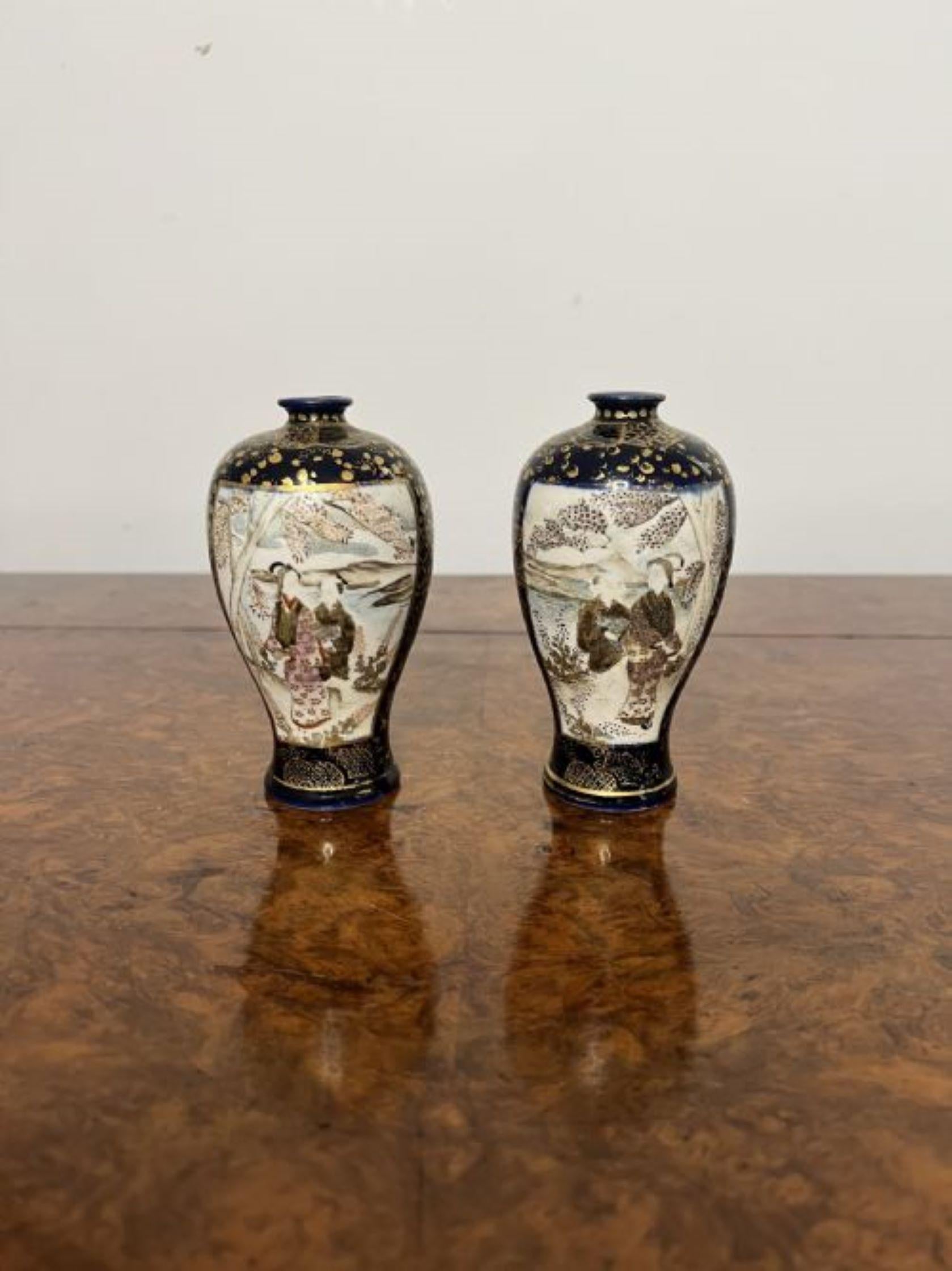 Fantastic quality pair of small antique Japanese satsuma vases having a quality pair of antique Japanese satsuma vases with wonderful hand painted decoration of figural and landscape scenes in blue, gold, brown, green and white colours.