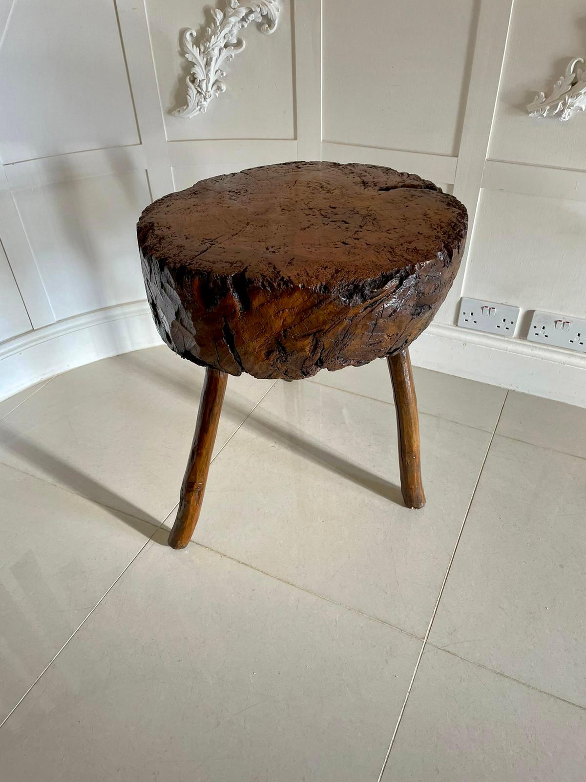 Fantastic quality unusual antique elm chopping block having a fantastic quality elm top raised on three original shaped legs.

An usual but wonderfully decorative piece having a very desirable colour and patina. 

Measures: H 67 x W 55 x D