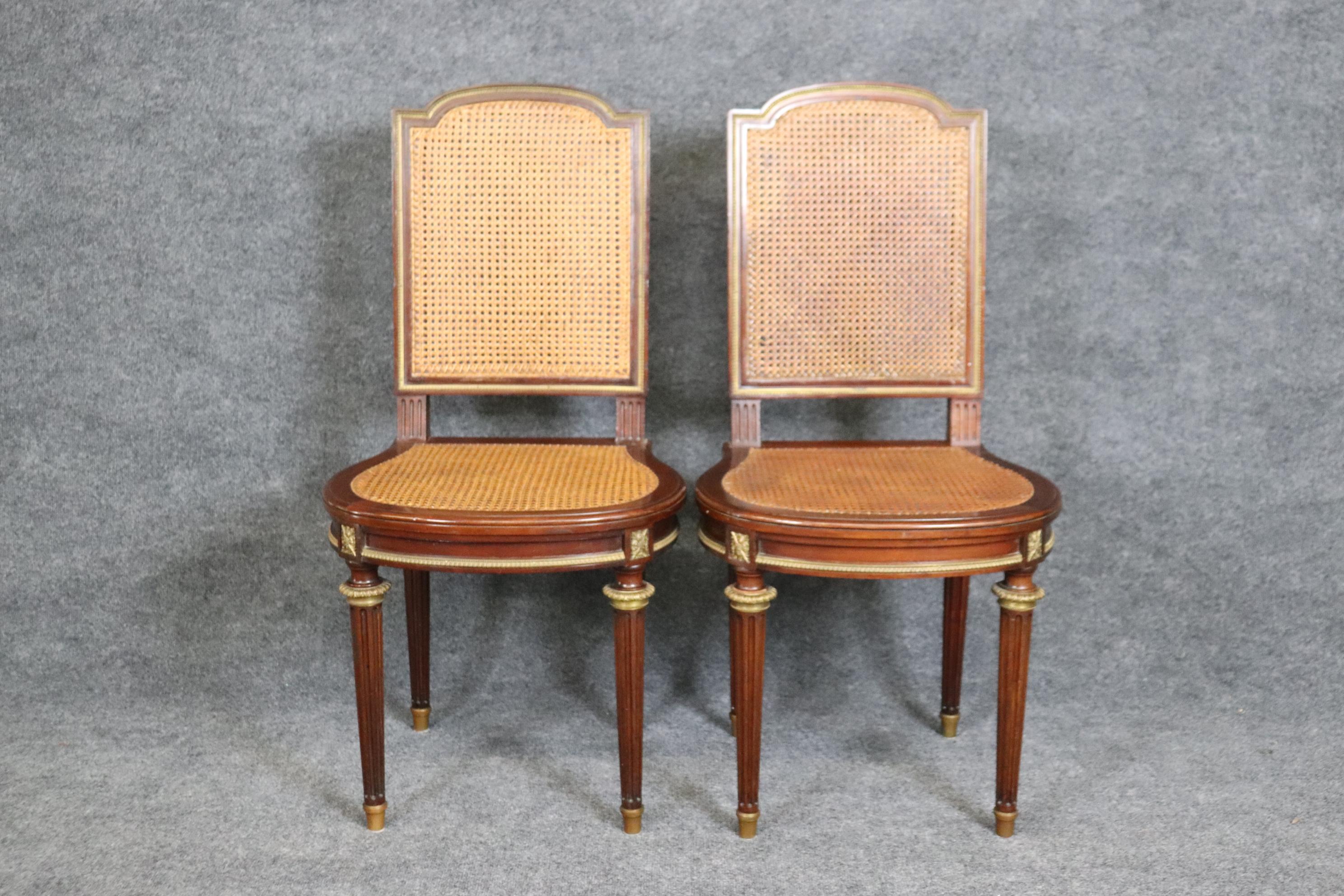 This is a gorgeous pair of French Louis XVI style signed Francois Linke Cane back and seated walnut side chairs. They are in good condition with minor signs of age and use but nothing significiant. Measures 19.5 deep x 19.75 wide x 40 tall x 18.75