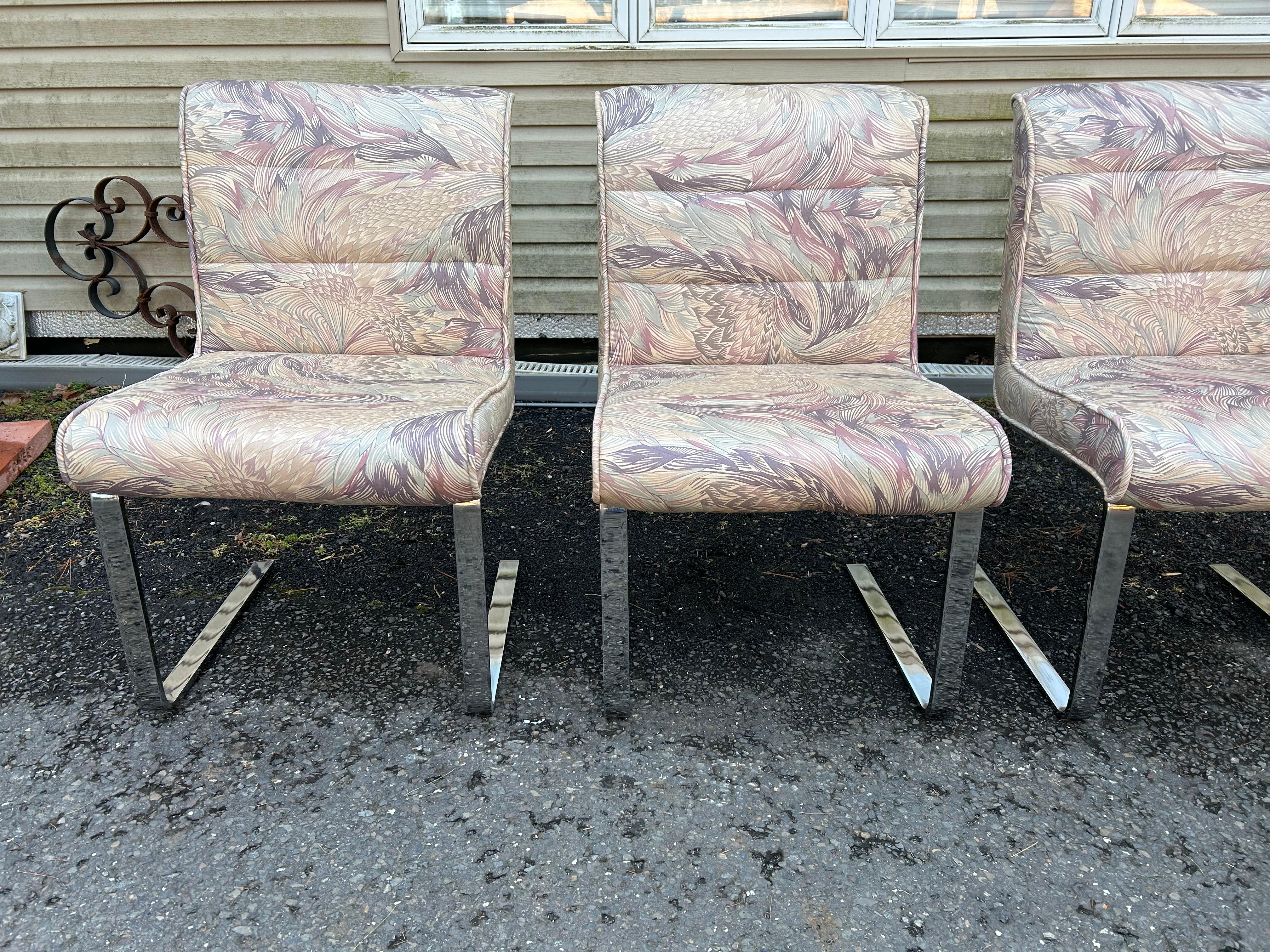 Fantastic set of 4 Mariani Laguna Pace Collection cantilevered chrome dining chairs. These Italian mid-century modern chairs retain their original upholstery, which is in good condition with minor wear-some minor spots.  The heavy chrome frames are