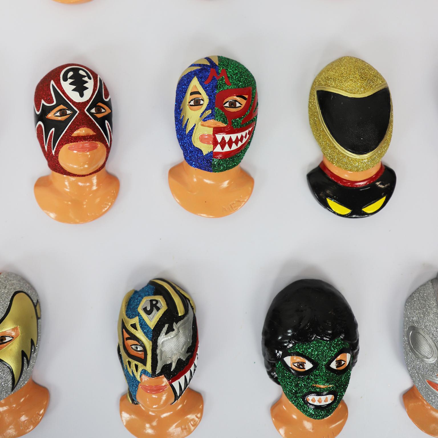 We offer this fantastic set of 13 Mexican wrestling fighters heads, made in resin and hand painted.