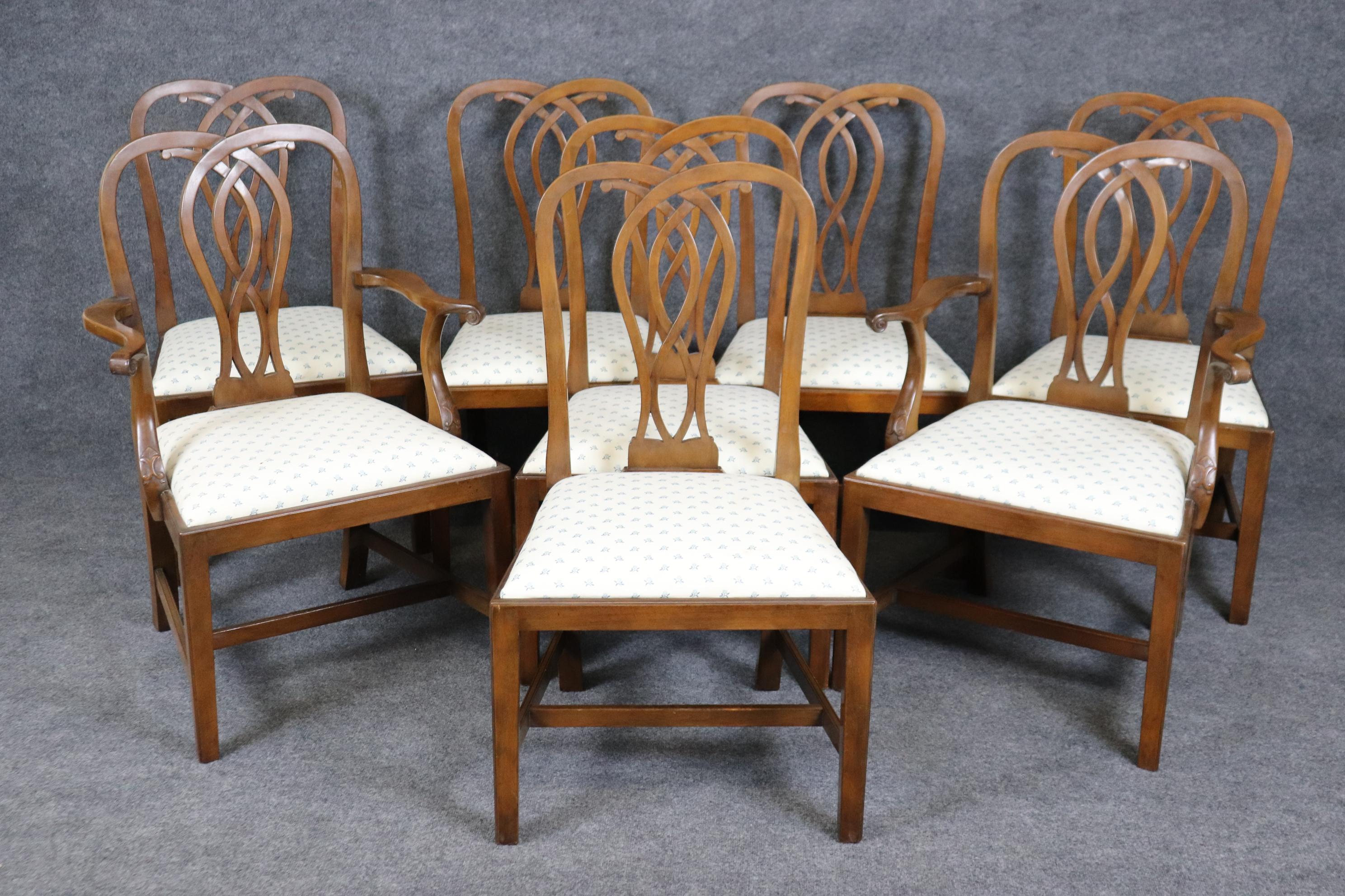 This is a clean set of CW (Colonial Williamsburg) dining chairs. This is a classic and sought after set of chairs. Not easy to find anywhere and in good condition. The classic and restrained carved backs and the Marlborough legs are sophisticated