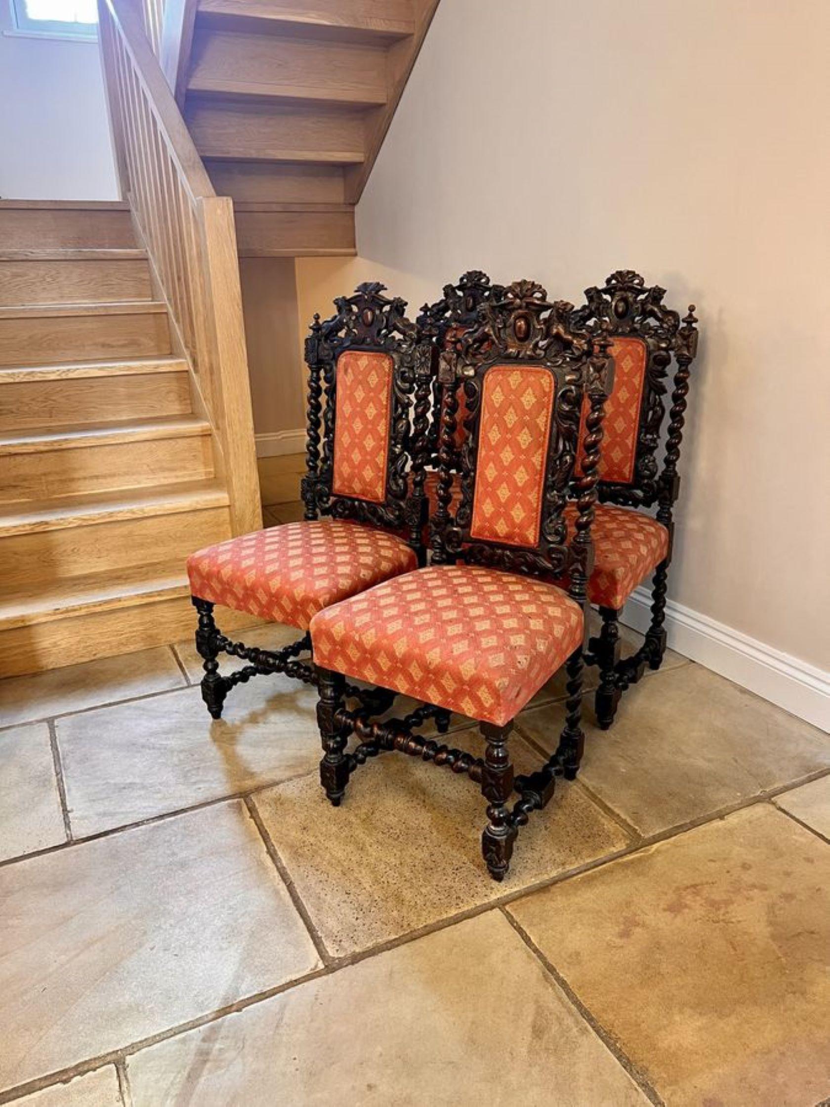 Fantastic set of four quality carved oak antique Victorian dining chairs having quality carved oak back with carved lions to the top, barley twist supports, carved scrolls upholstered panel backs and seats, standing on turned carved legs to the