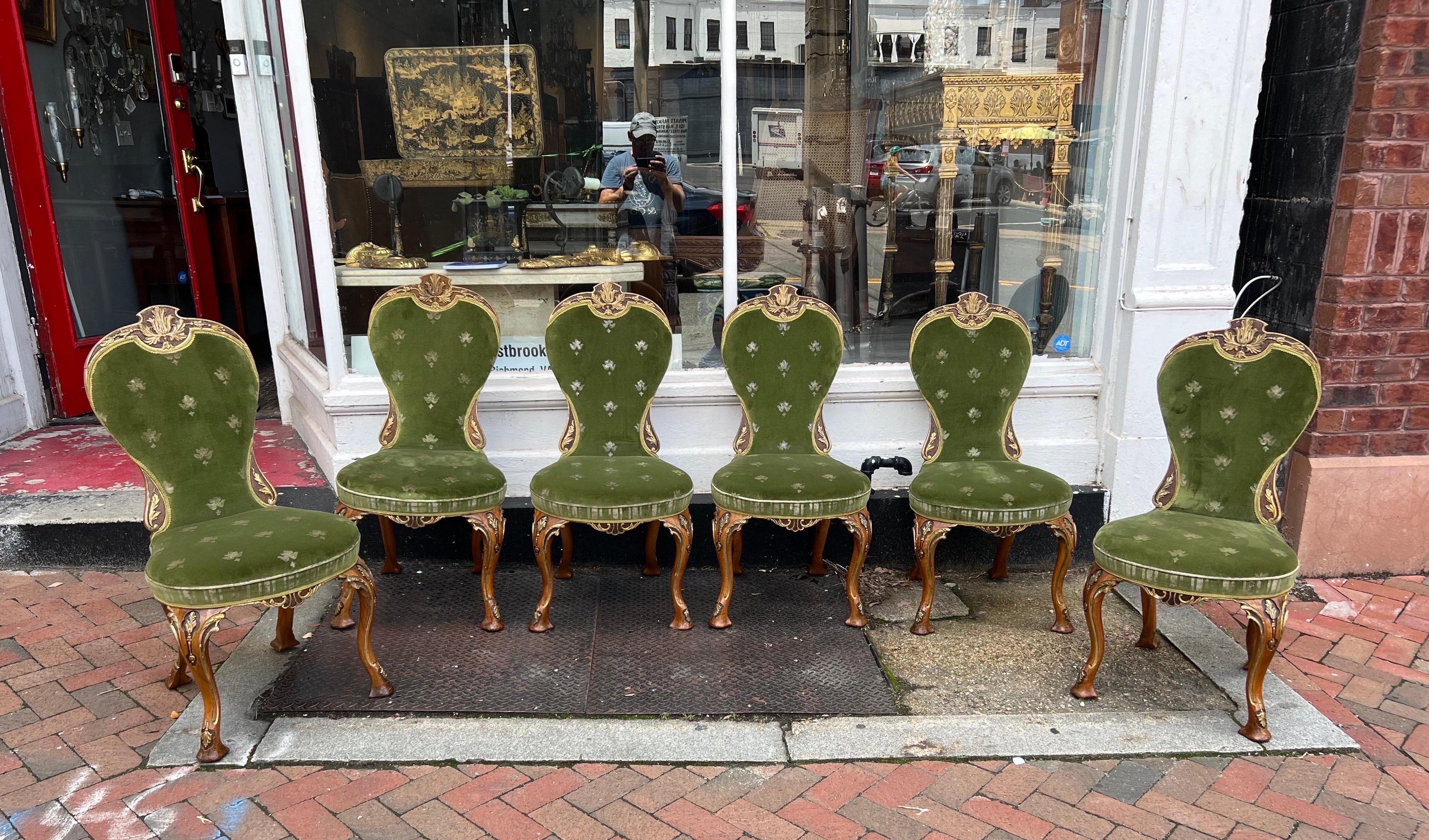 Fantastic set of 6 George II style side chairs from the late 19th century. Parcel gilt decoration, hand carved and gorgeous green velvet upholstery.