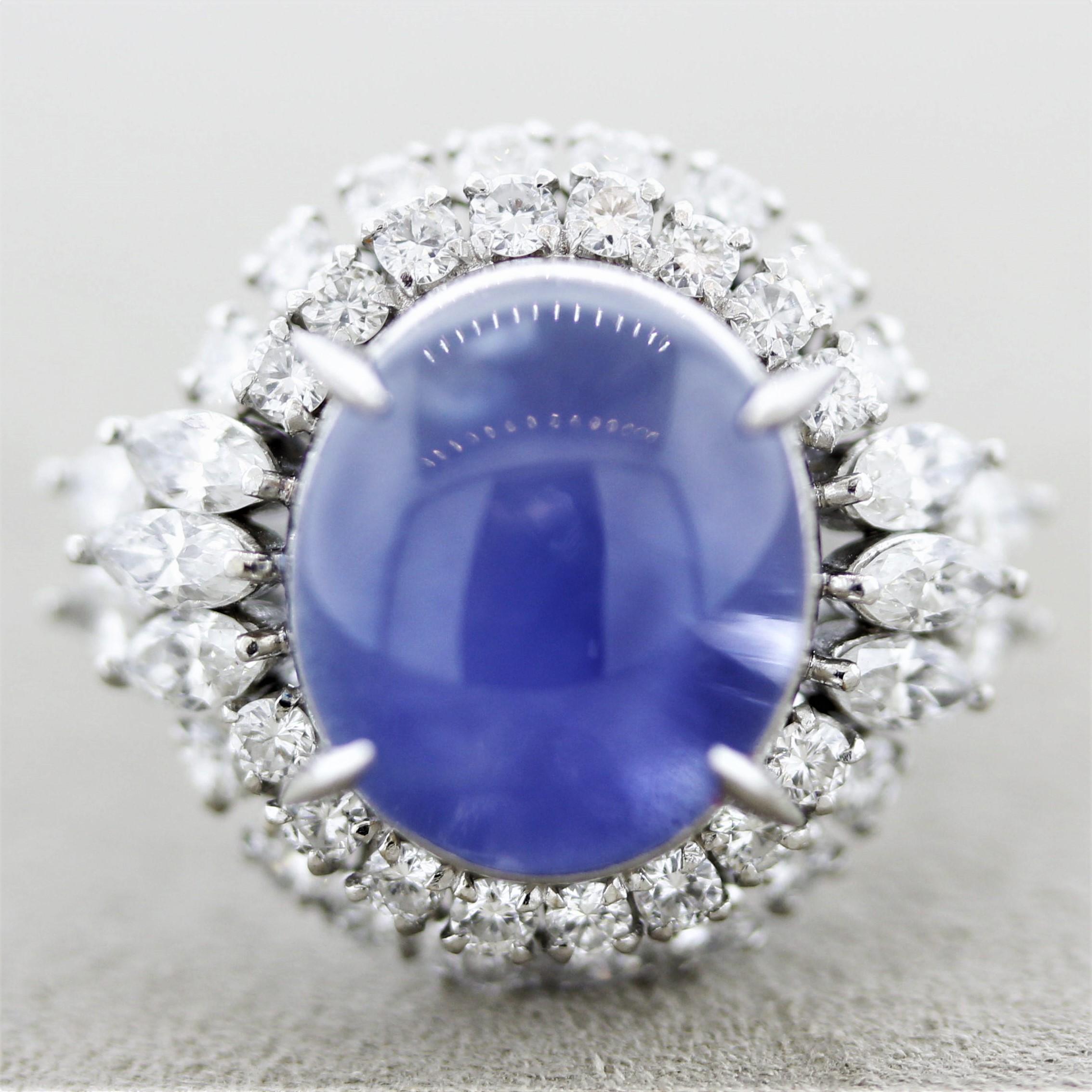 A fine and classy ring featuring a star sapphire dazzled by an array of large bright white diamonds. The sapphire weighs 10.57 carats and has a rich vivid blue color as well as a strong 6-rayed star. The sapphire is also untreated in anyways and has