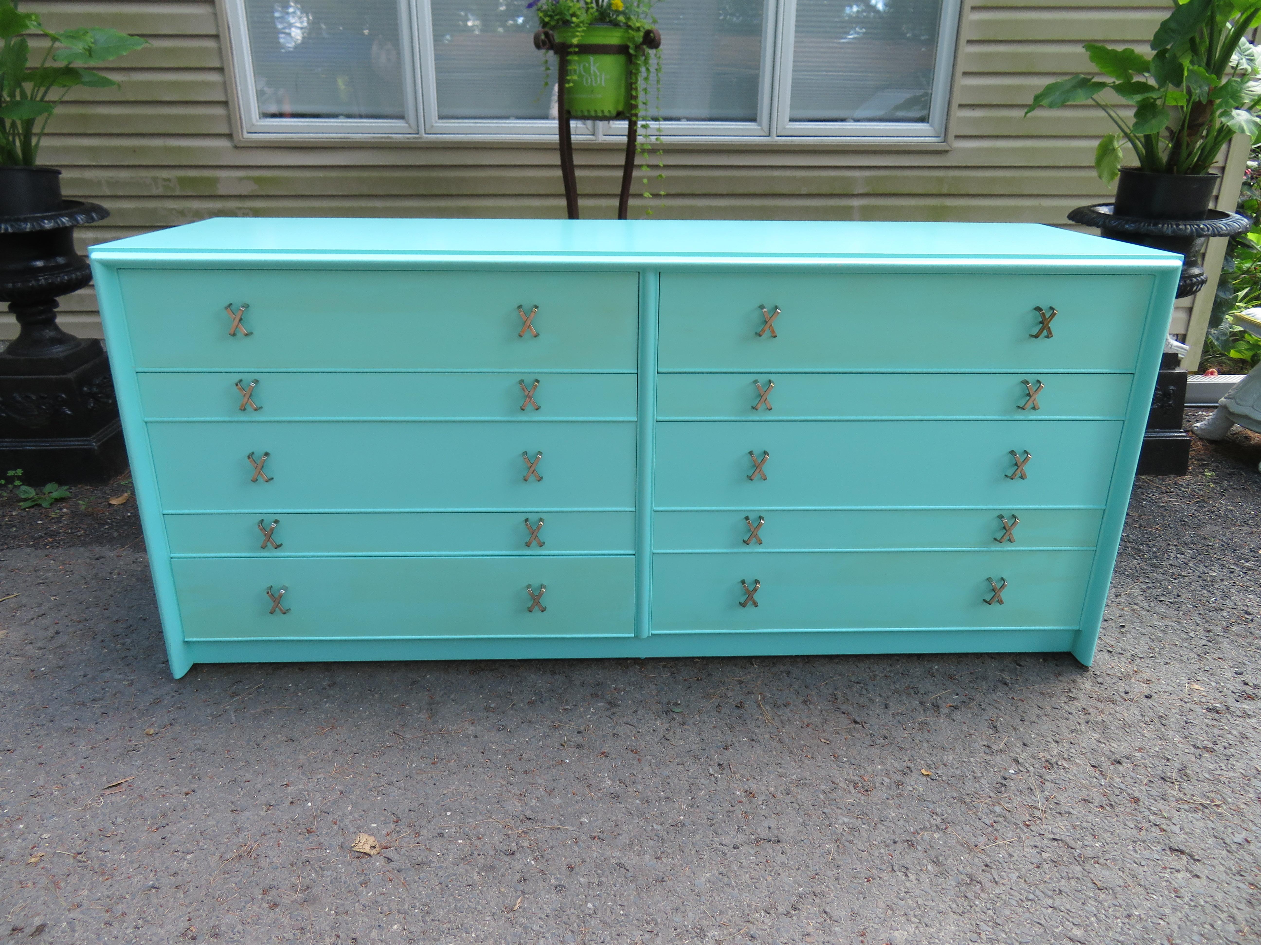 Fantastic Tiffany box blue Paul Frankl X-pull dresser credenza. This piece was restored by the original owner about 10 years ago and still looks great. The said they had it professionally repainted with this Tiffany box blue color and is gorgeous in