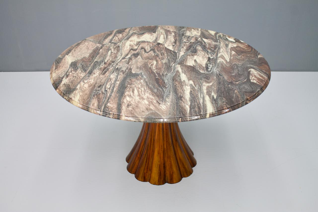 A fantastic marble table with a waved cast metal base and a spectacular marble top. Attributed to Angelo Mangiarotti, 1960s.

Very good condition.