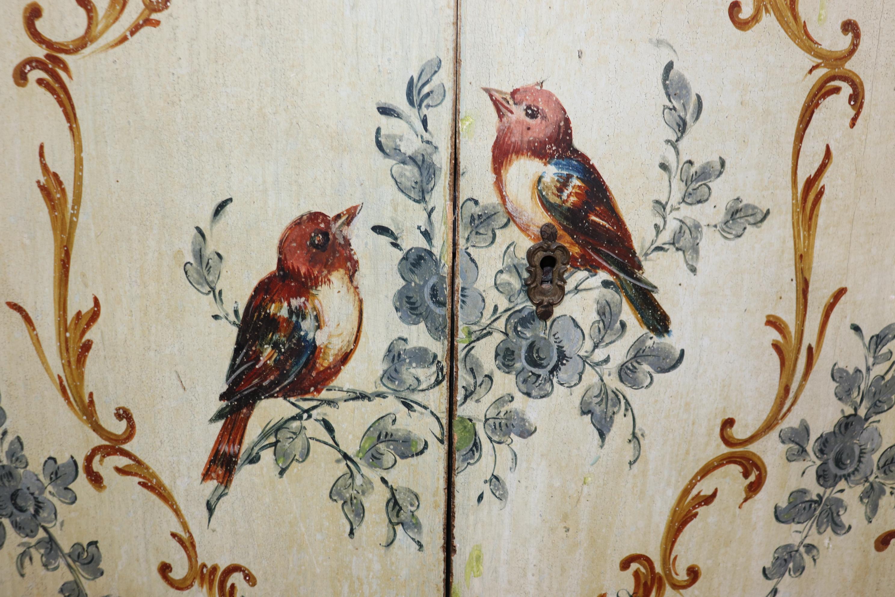 This is a gorgeous Venetian Paint Decorated with painted birds and floral foliage. The commode has a shelf in the center and the finish has that great time-worn distressed look. The commode measures 33.25 tall x 31.25 wide x 13.25 deep. Great for