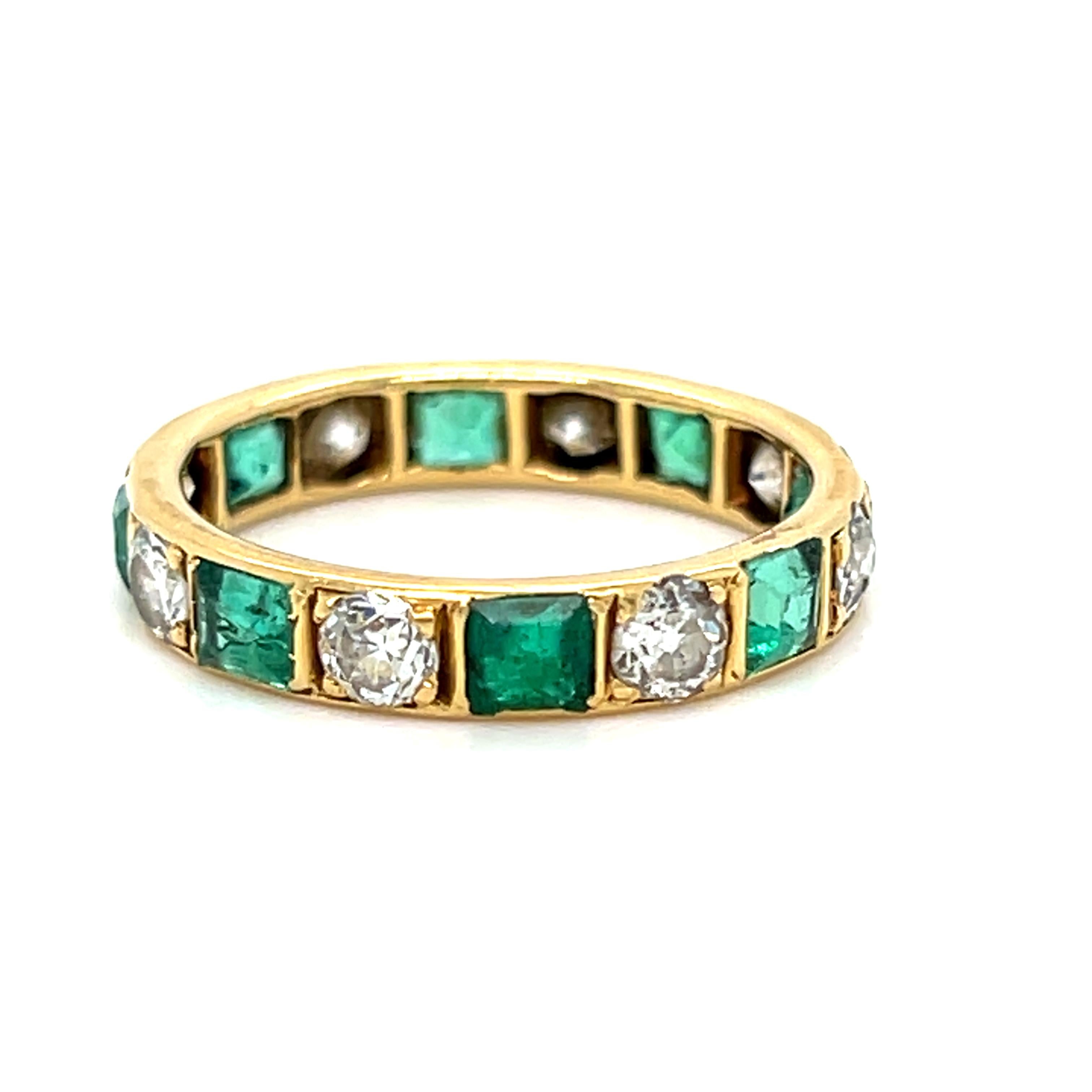 I just love this Fantastic Vintage Emerald and Diamond Eternity Band Wedding Band. Such a unique vintage piece! Crafted in 18K Yellow Gold, the band features an alternating round diamond and square emerald design. There are 8 Square Cut Emeralds,