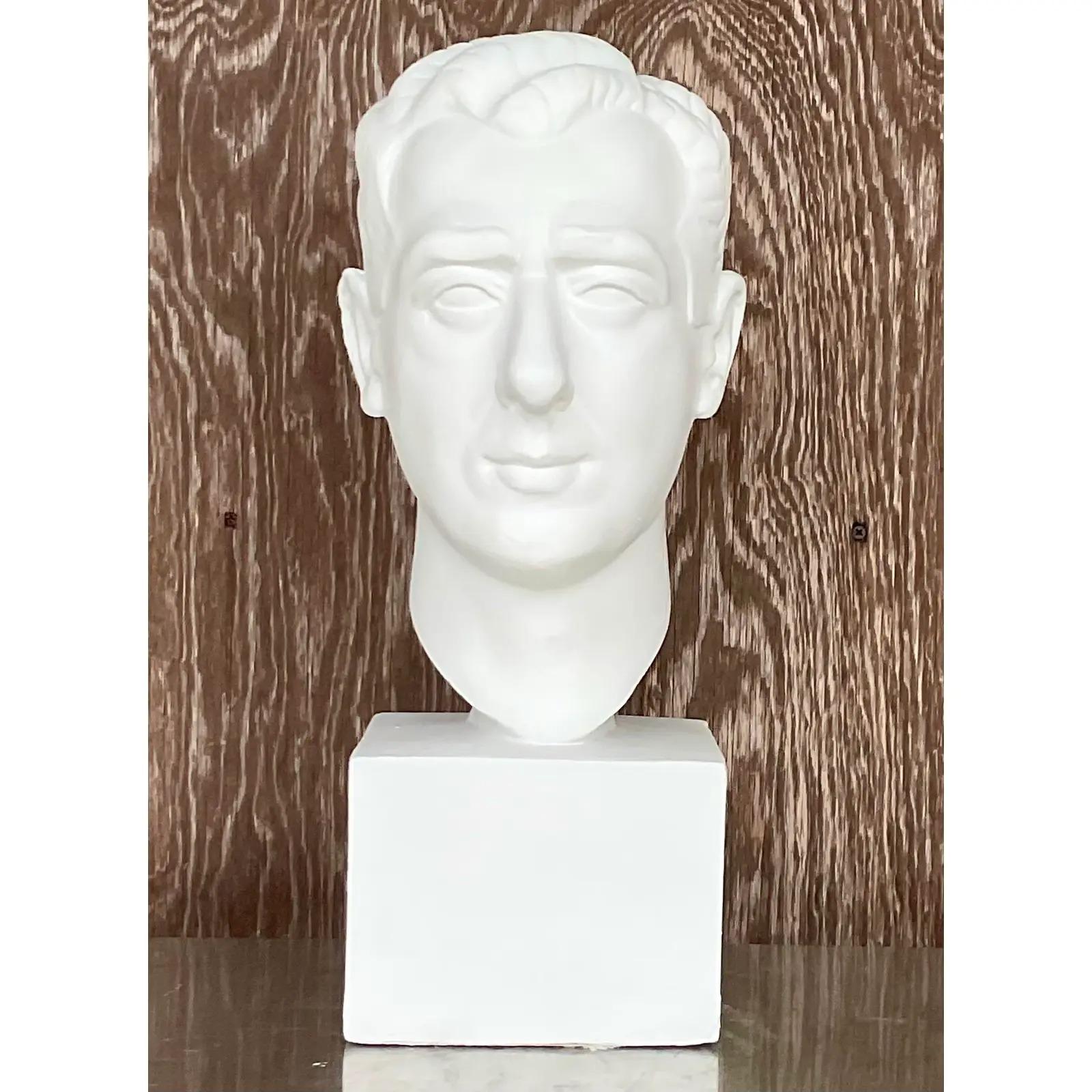 Fantastic vintage plaster sculpture of man. A handsome profile with stylish wavy hair. Rests on a plaster plinth. Acquired from a palm beach estate.