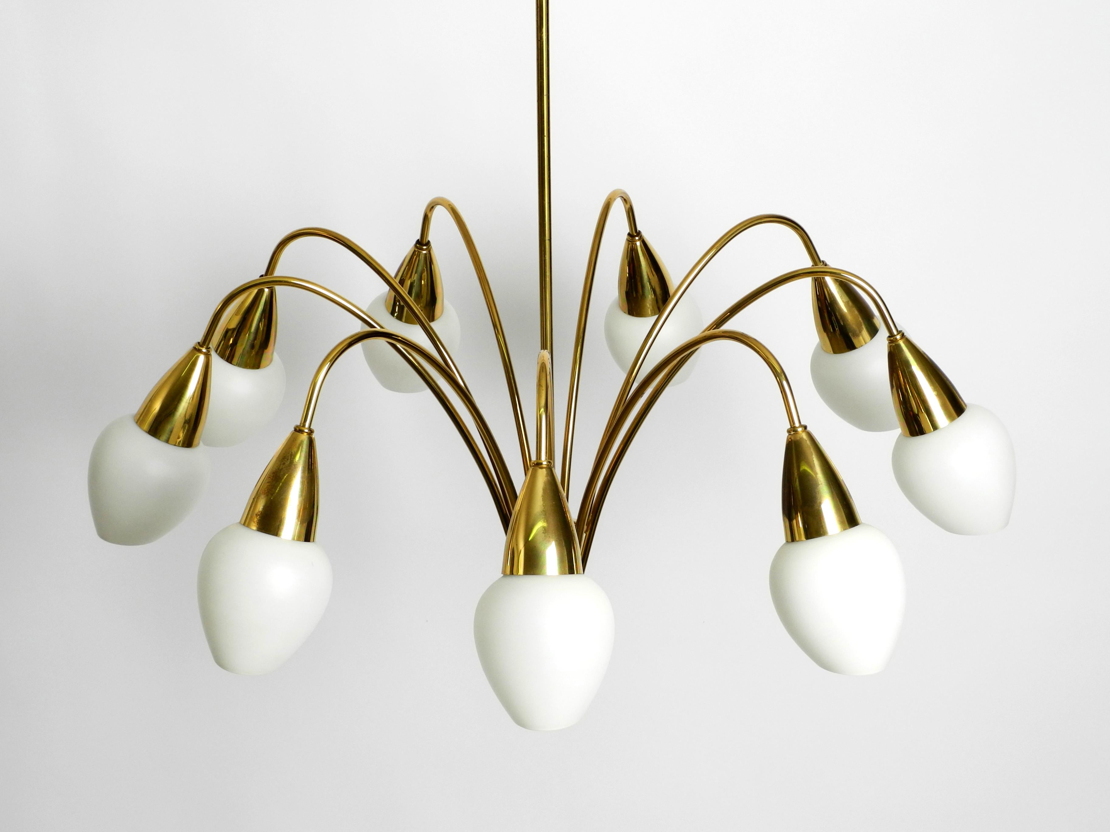 Mid-Century Modern Fantastically 9-armed large mid-century brass chandelier with opal glass shades For Sale