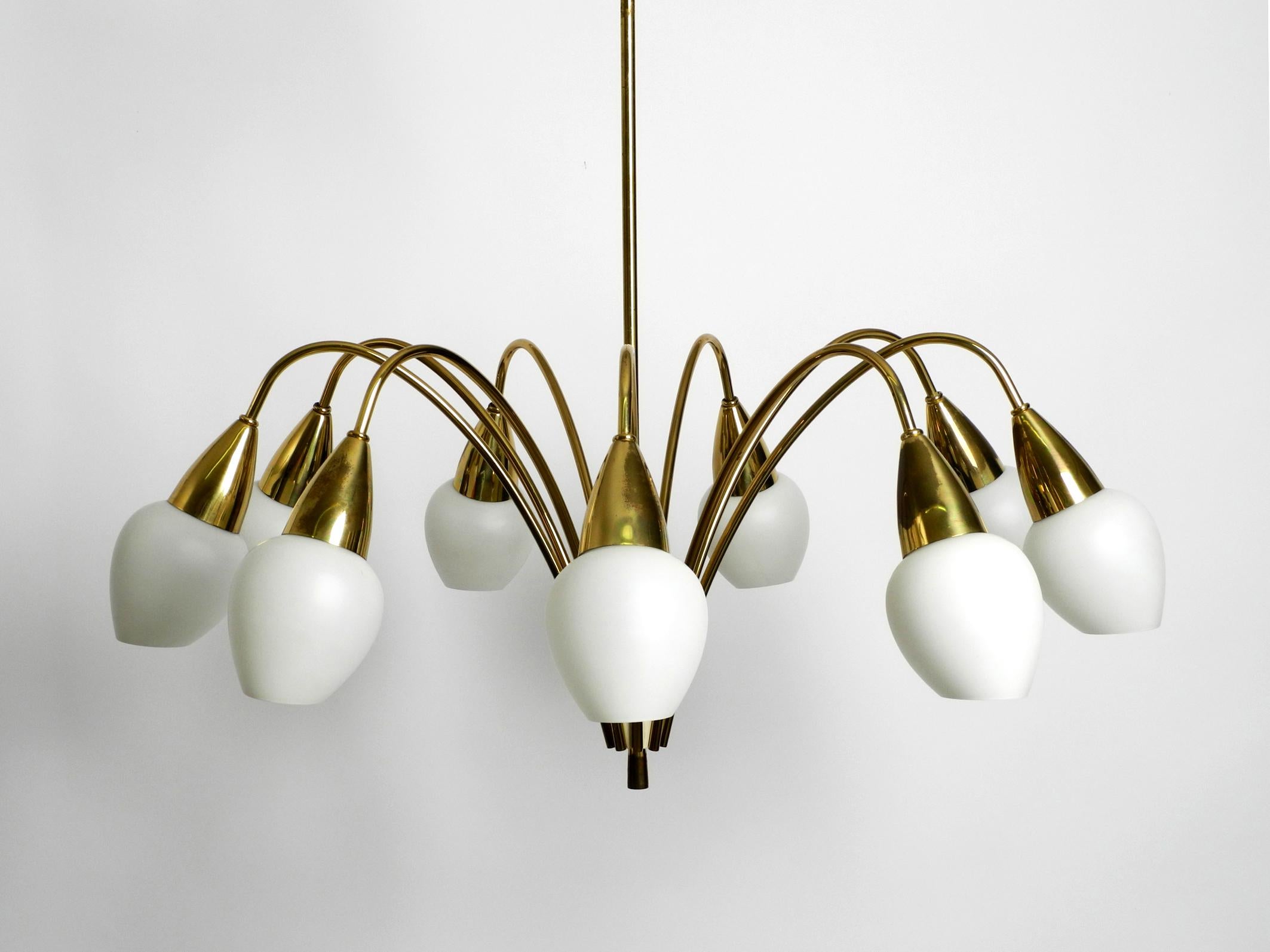 German Fantastically 9-armed large mid-century brass chandelier with opal glass shades For Sale