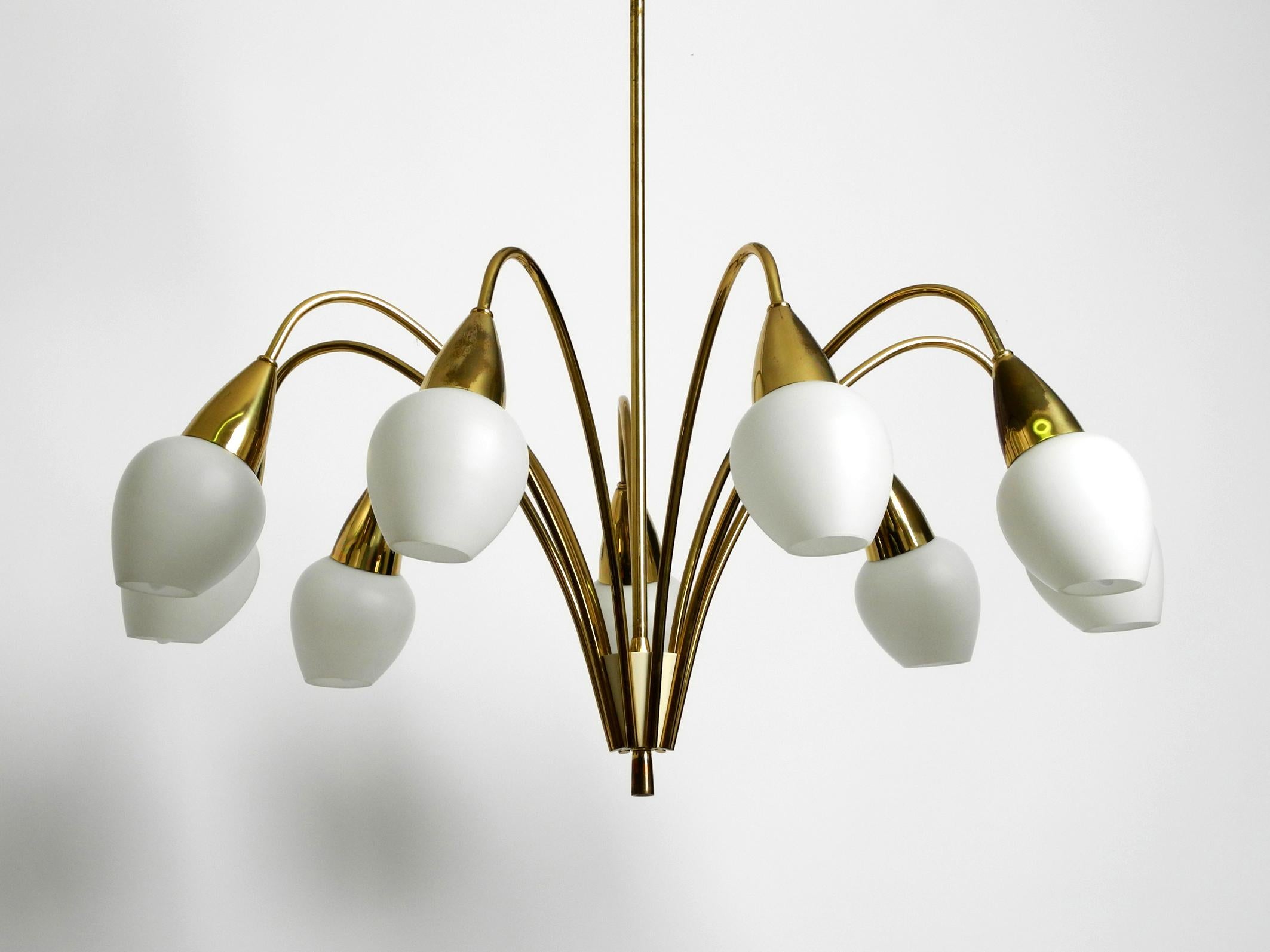 Fantastically 9-armed large mid-century brass chandelier with opal glass shades In Good Condition For Sale In München, DE