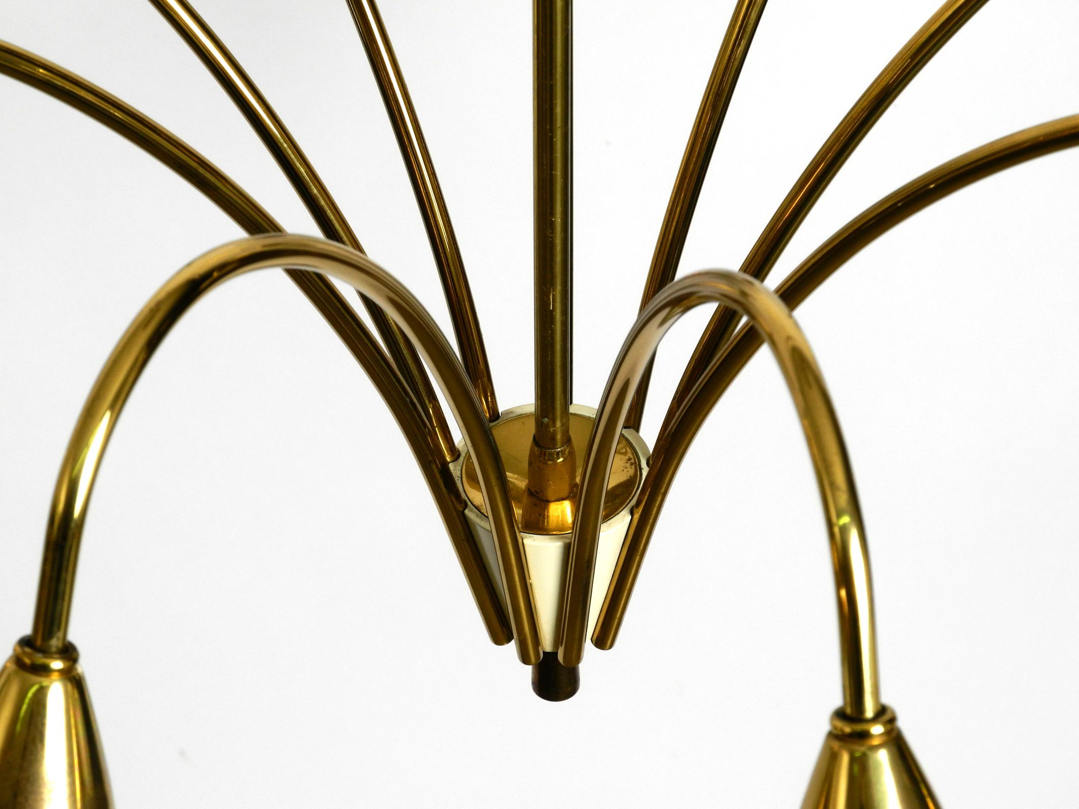 Brass Fantastically 9-armed large mid-century brass chandelier with opal glass shades For Sale