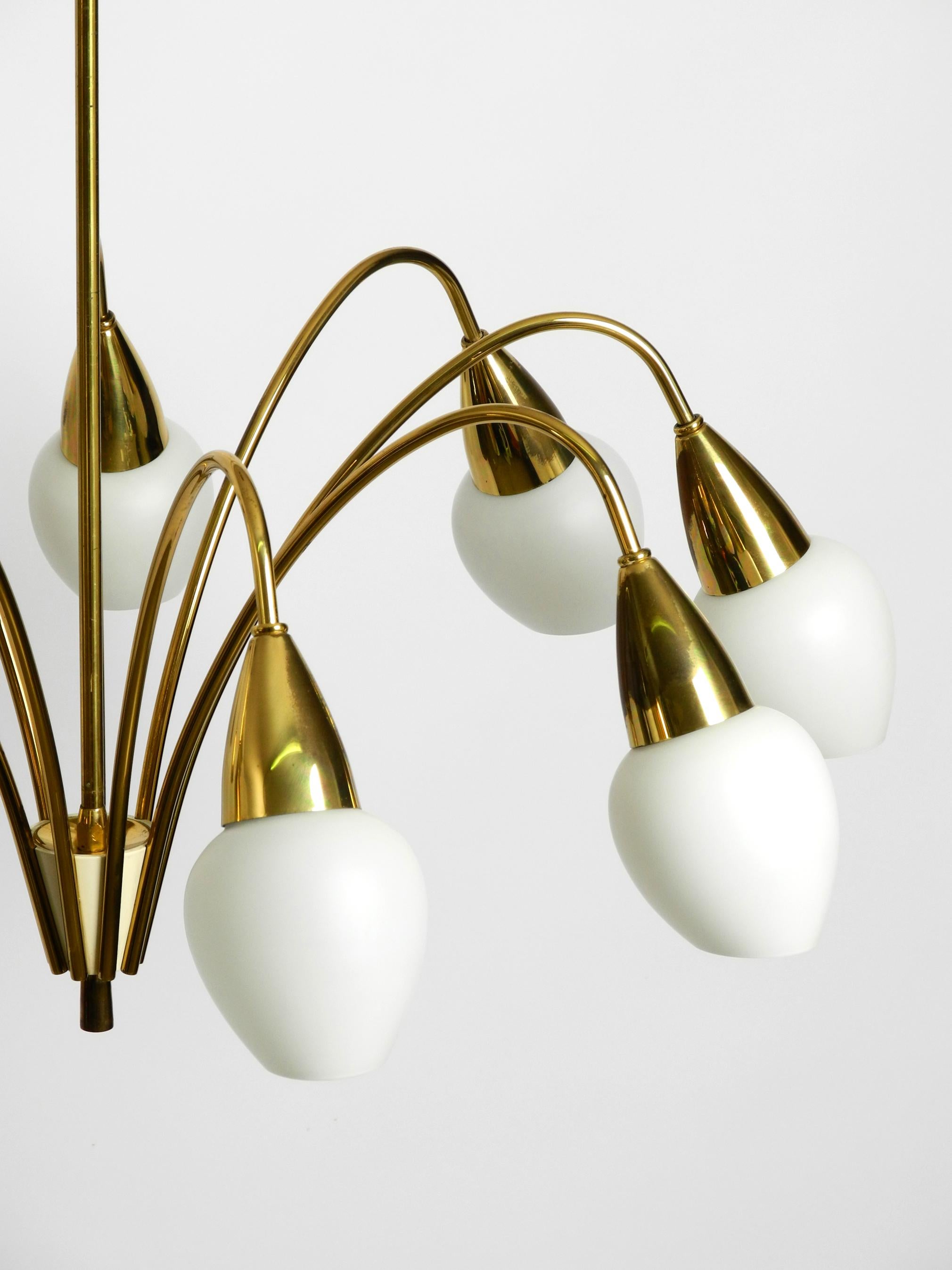 Fantastically 9-armed large mid-century brass chandelier with opal glass shades For Sale 2