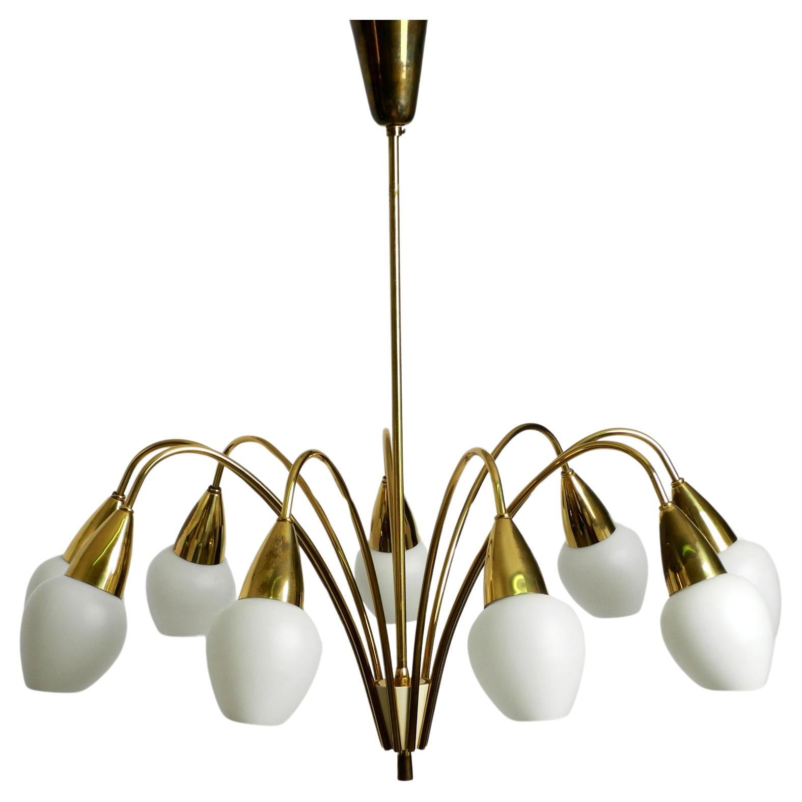 Fantastically 9-armed large mid-century brass chandelier with opal glass shades For Sale