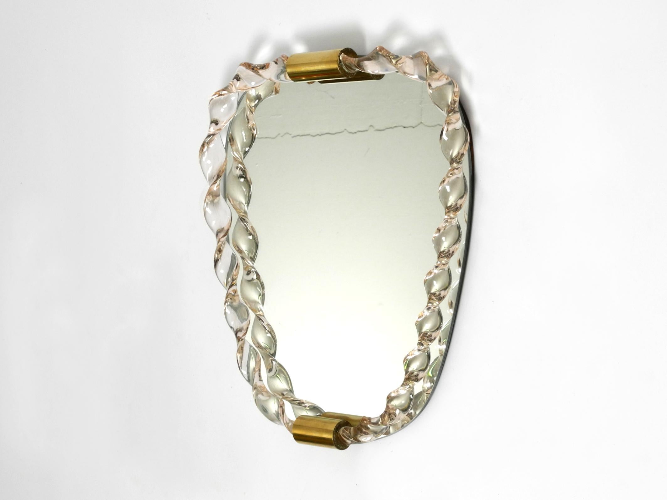 Mid-Century Modern Fantastically beautiful 1960s wall mirror with a heavy Murano glass frame