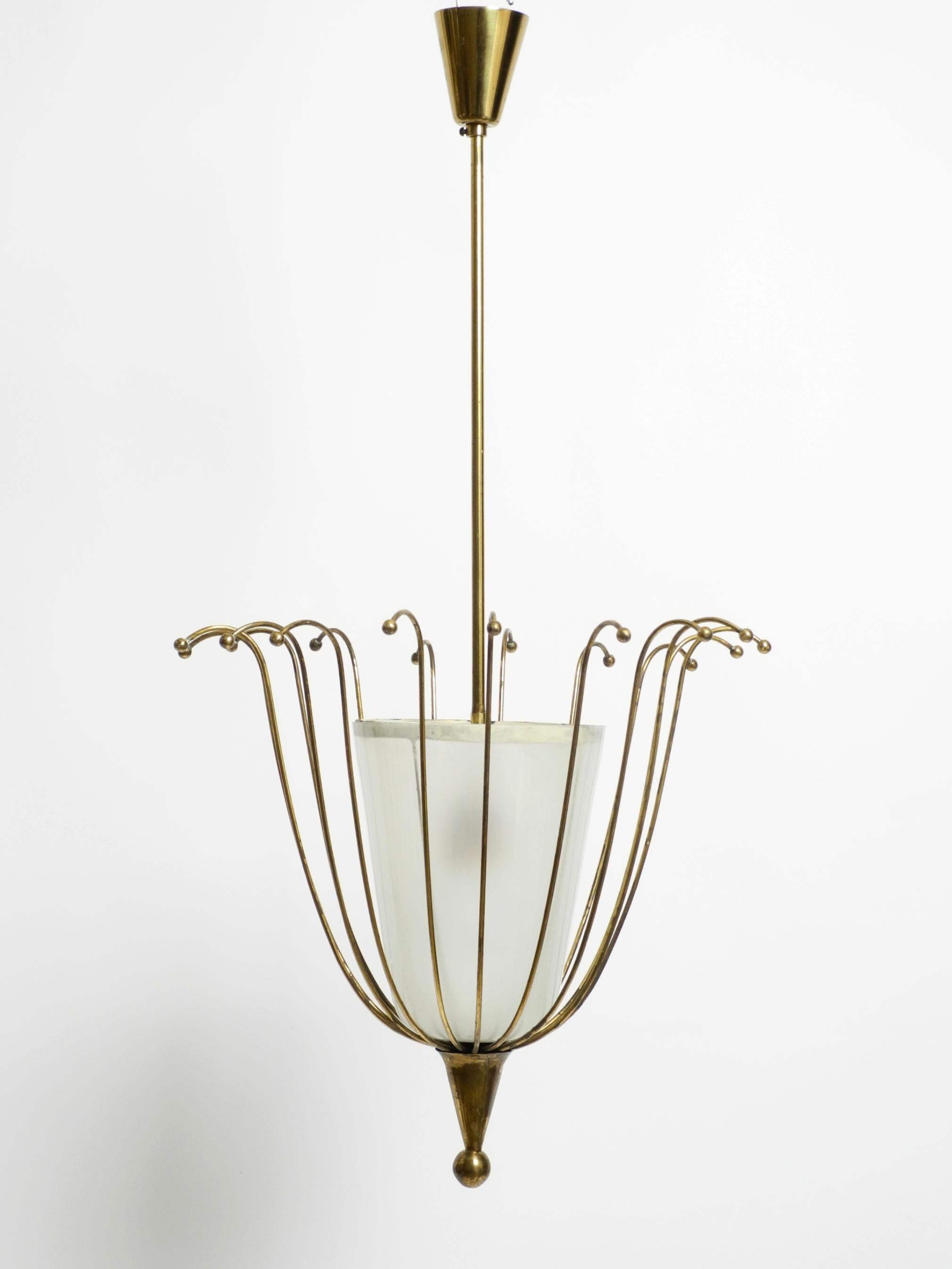 Fantastically Italian Mid Century ceiling lamp made of brass and glass shade 10