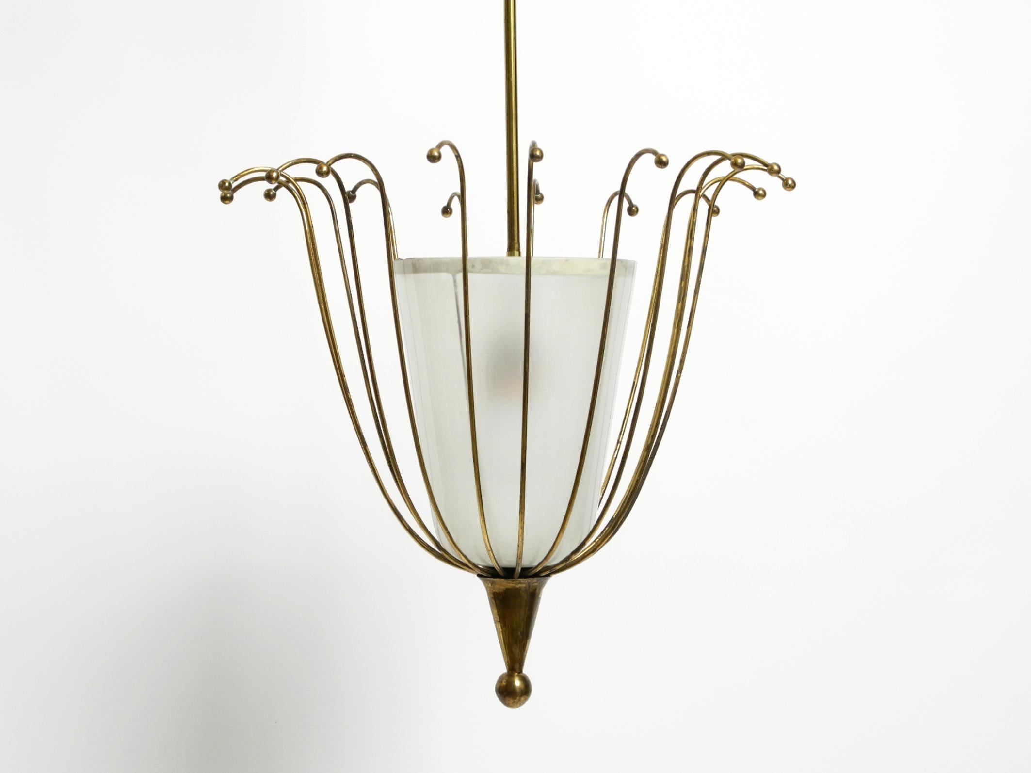 Fantastically Italian Mid Century ceiling lamp made of brass and glass shade 11