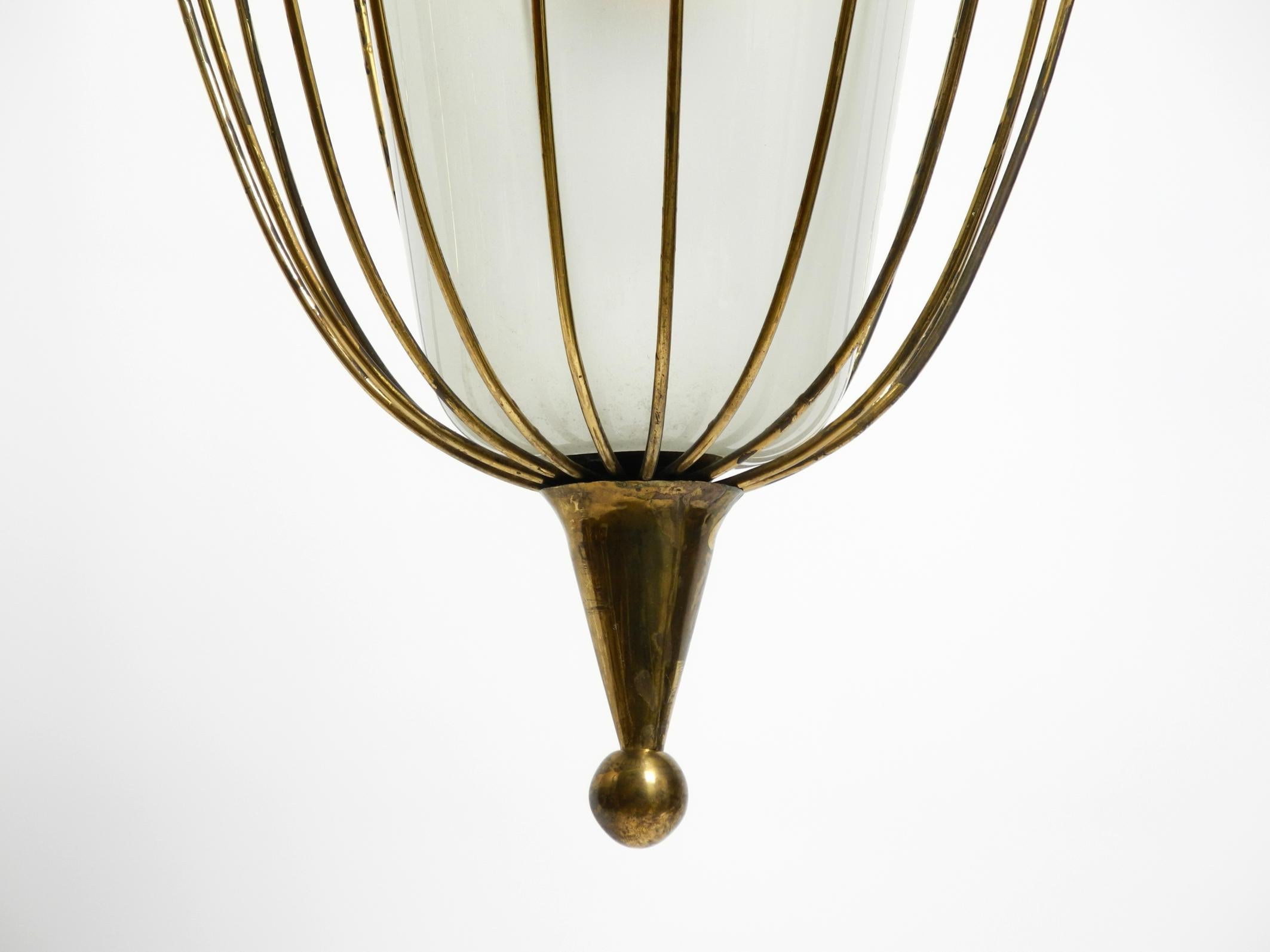 Fantastically Italian Mid Century ceiling lamp made of brass and glass shade 12