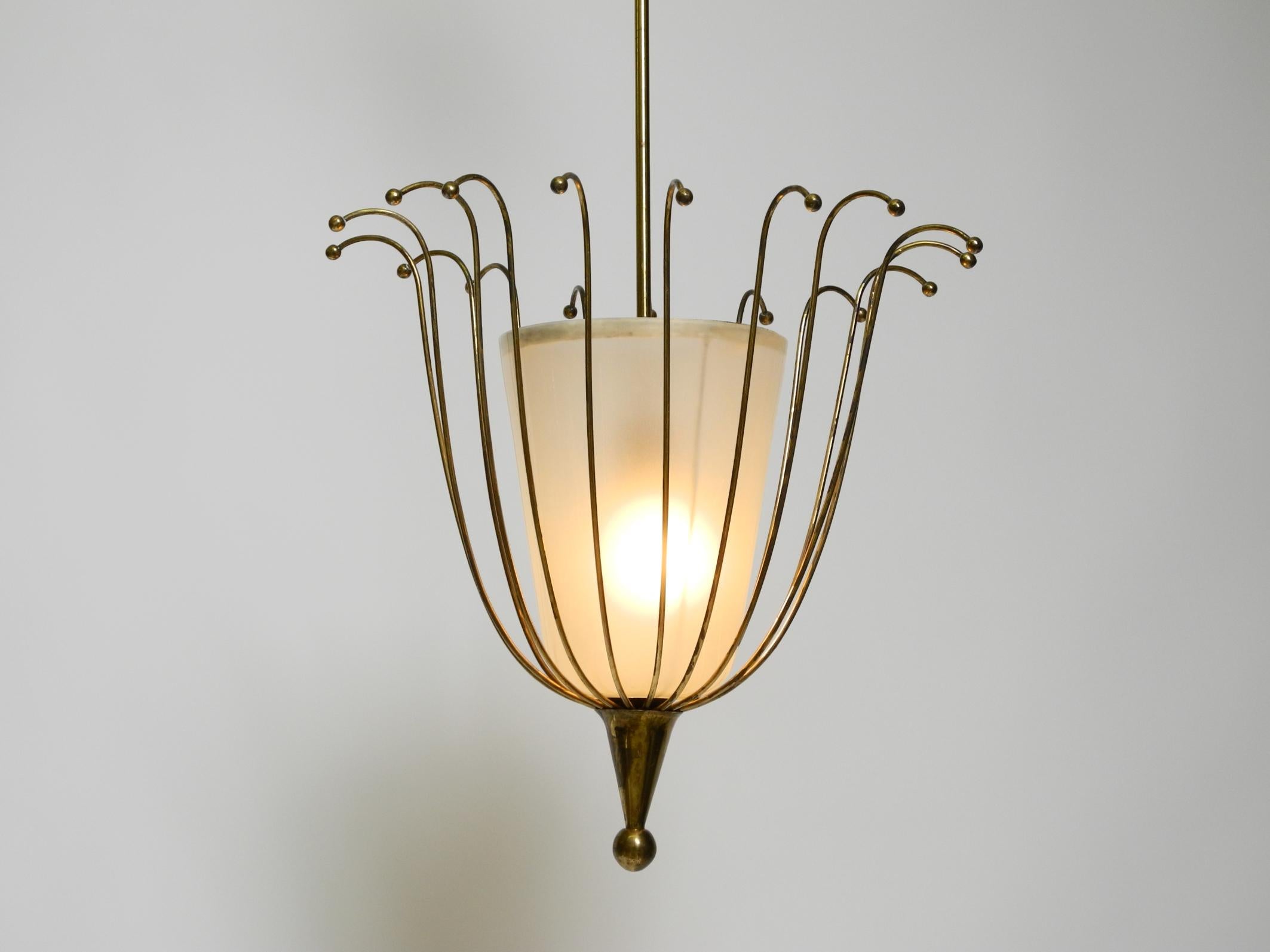 Mid-Century Modern Fantastically Italian Mid Century ceiling lamp made of brass and glass shade