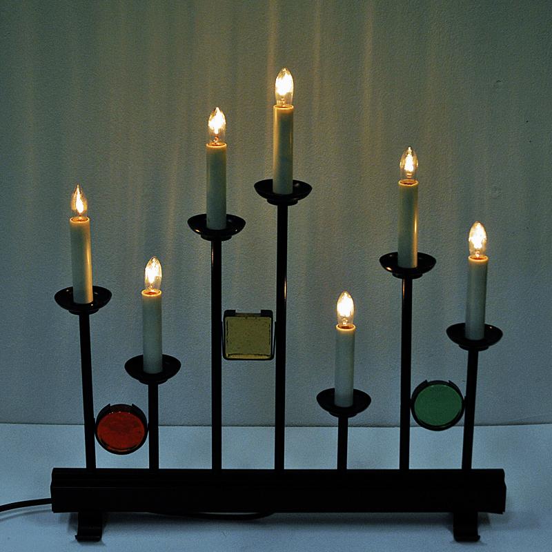The candlelights of all candlelights! Beautiful Fantasi 97 candelabrum by Erik Höglund made for Osram, Sweden in the 1960s. The candelabrum consists of lacquered metal and lovely colored yellow, red and green prisme art glasses with 7 electric