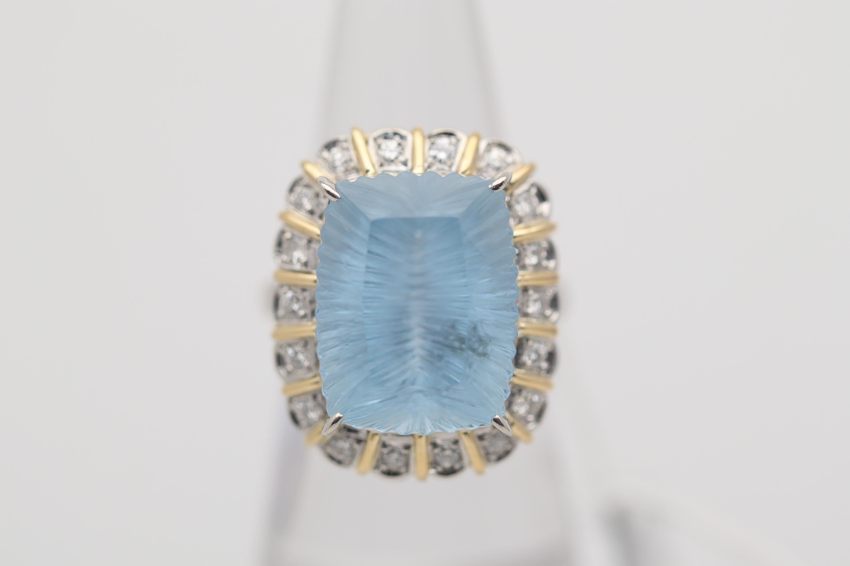 A unique and stylish ring featuring a 11.52 carat aquamarine with a high precision fantasy-cut. While the crown of the aquamarine is a traditional brilliant-cut the pavilion (bottom half) of the stone is a unique fantasy-cut which gives the stone a