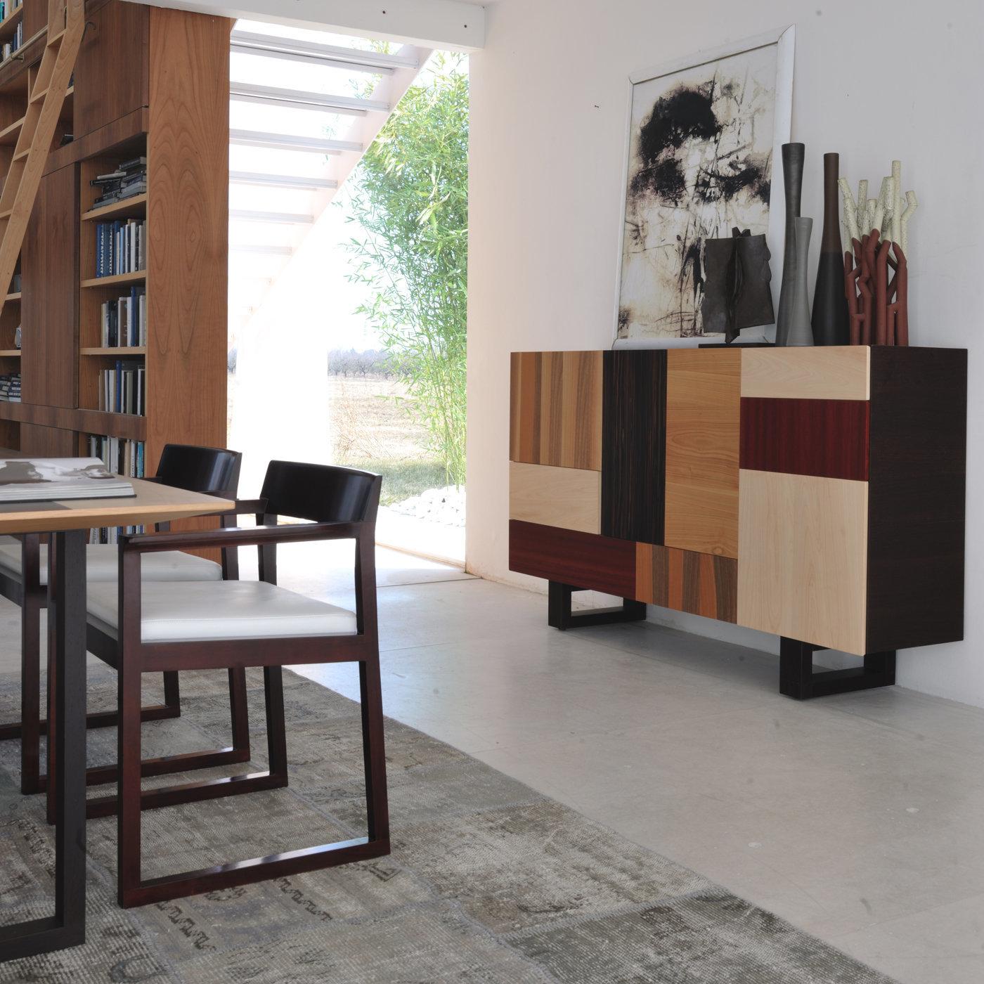 The Patchwork collection designed by Maurizio Duranti for Morelato is intended as a collection able to express the concept of modern furniture but at the same time remaining in the field of skillful cabinet making. The sideboard is made of wengé