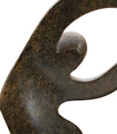 "Helping Brother Fly Overseas, " serpentine stone sculpture by Farai Darare