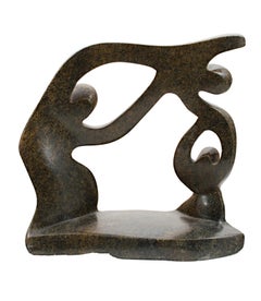 "Helping Brother Fly Overseas, " serpentine stone sculpture by Farai Darare