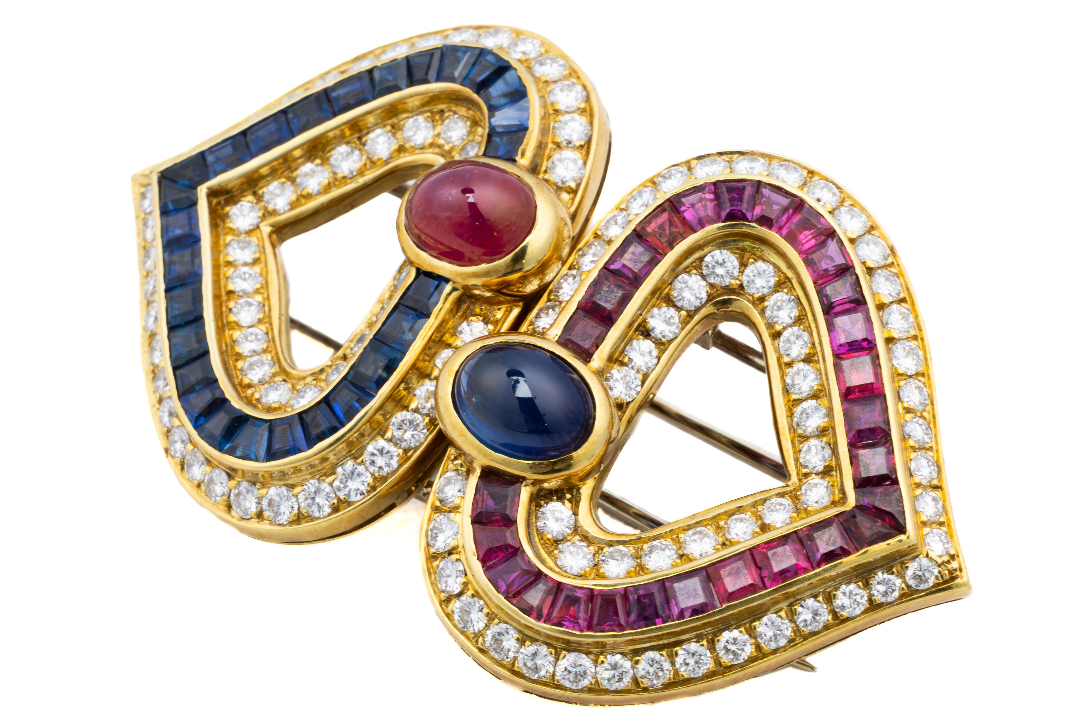 Faraone Cabochon Ruby, Sapphire, and Diamond Heart Earring & Brooch Set

This playful heart-shaped suite by Faraone includes a pair of earrings and a matching brooch, all set in rich 18k yellow gold. The brooch, designed as two interlocking hearts,