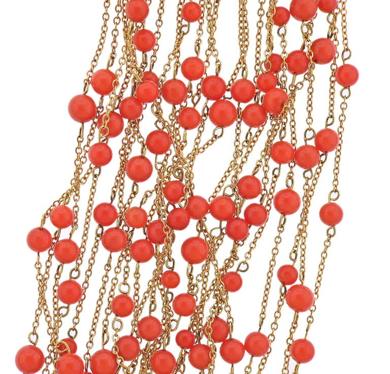18k gold multi strand necklace with tassels, by Faraone, with approx. 0.30cts in diamonds and coral beads (measuring approx. 4mm). Necklace is 20