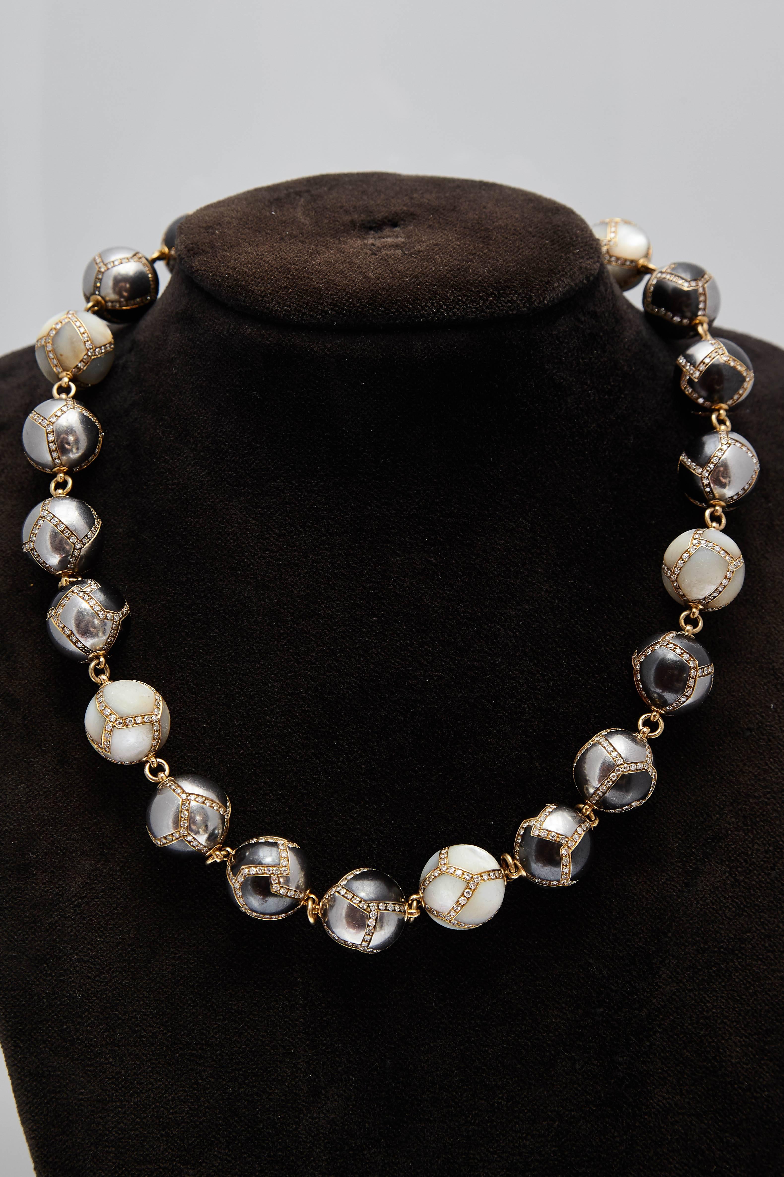 Faraone necklace in 18kt yellow gold with hematite and diamonds spheres. Made in Italy, circa 1970s.