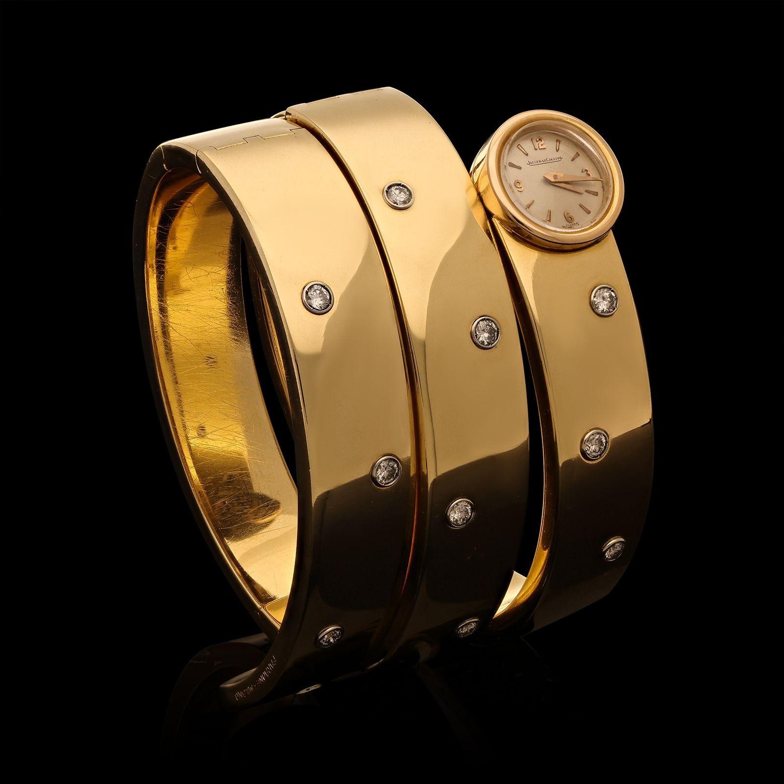 Ein Vintage Gold und Diamant Wraparound Uhr von Faraone und Jaeger-LeCoultre c.1980s, die Uhr wickelt sich um das Handgelenk dreimal und ist geschickt an mehreren Stellen gefedert, so dass es einfach zu setzen und abnehmen, ist die Vorderseite mit
