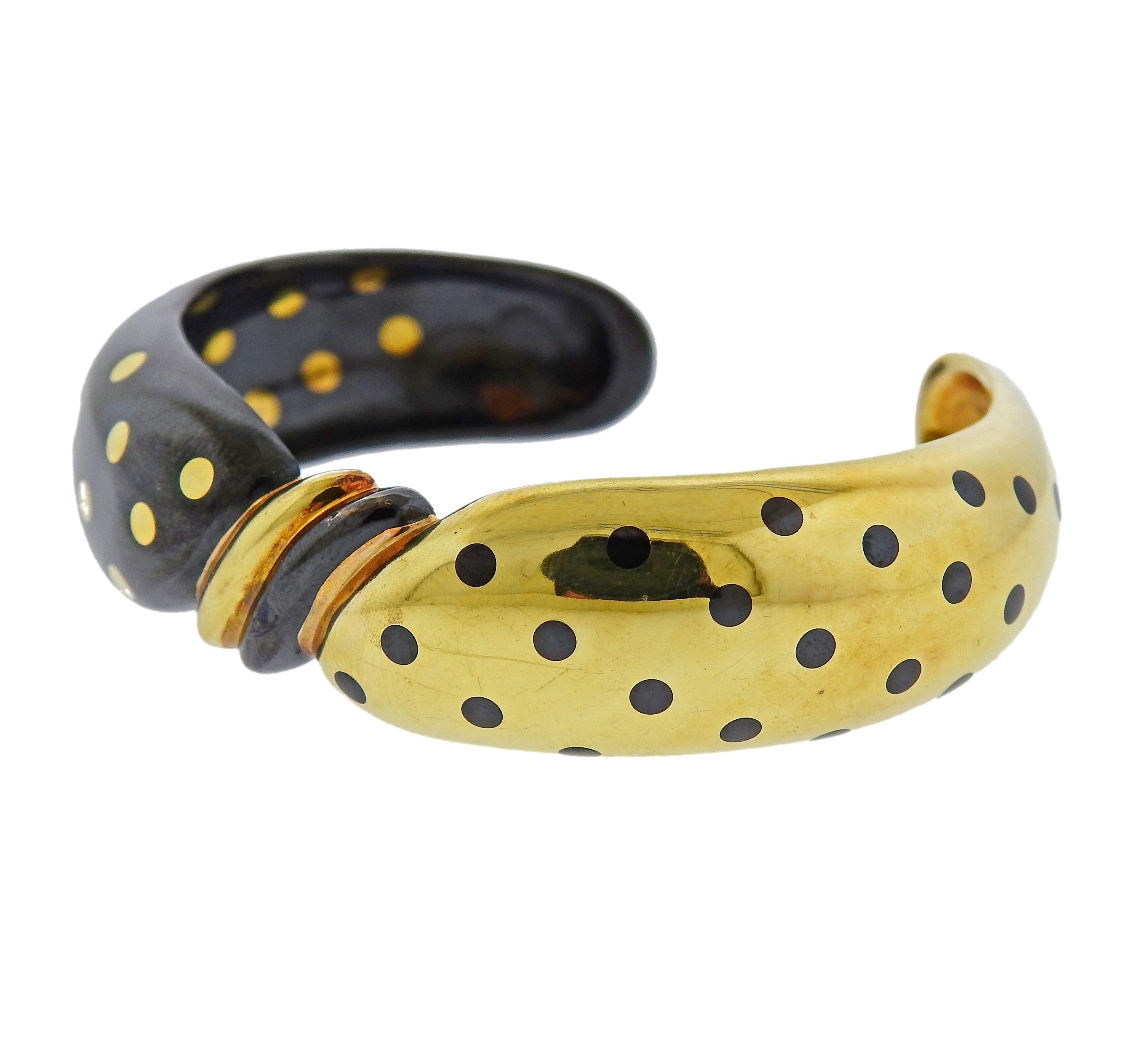 18k yellow gold and black enamel cuff bracelet, by Faraone. Will fit approx. 6