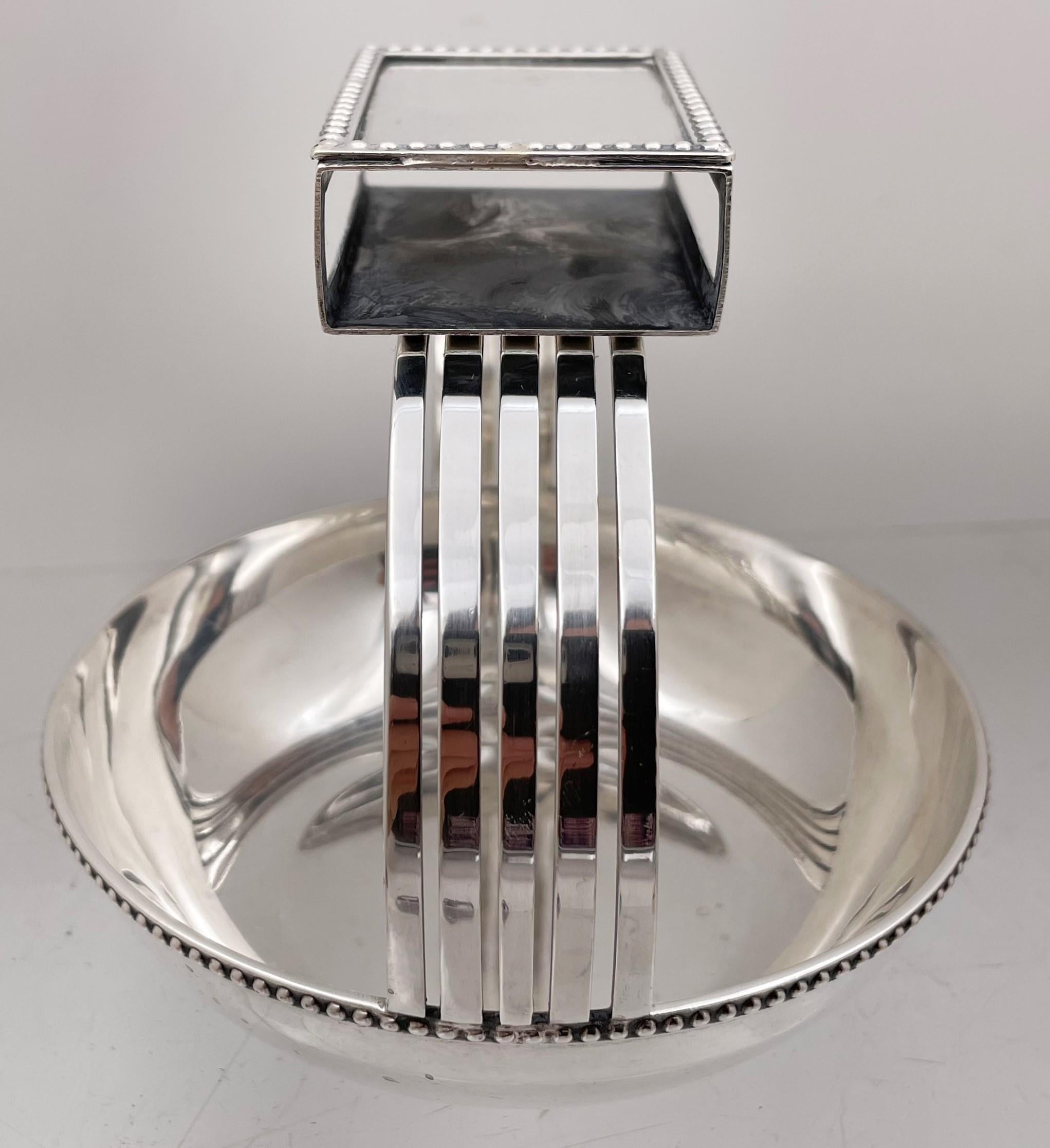Faraone, Italian silver ashtray with an integrated matchbox on top in Mid-Century Modern style, with an elegant, geometric design. The matchbox can be detached from the ashtray. It measures 4 1/2'' in height (height of the ashtray is 1 1/4'') by 4
