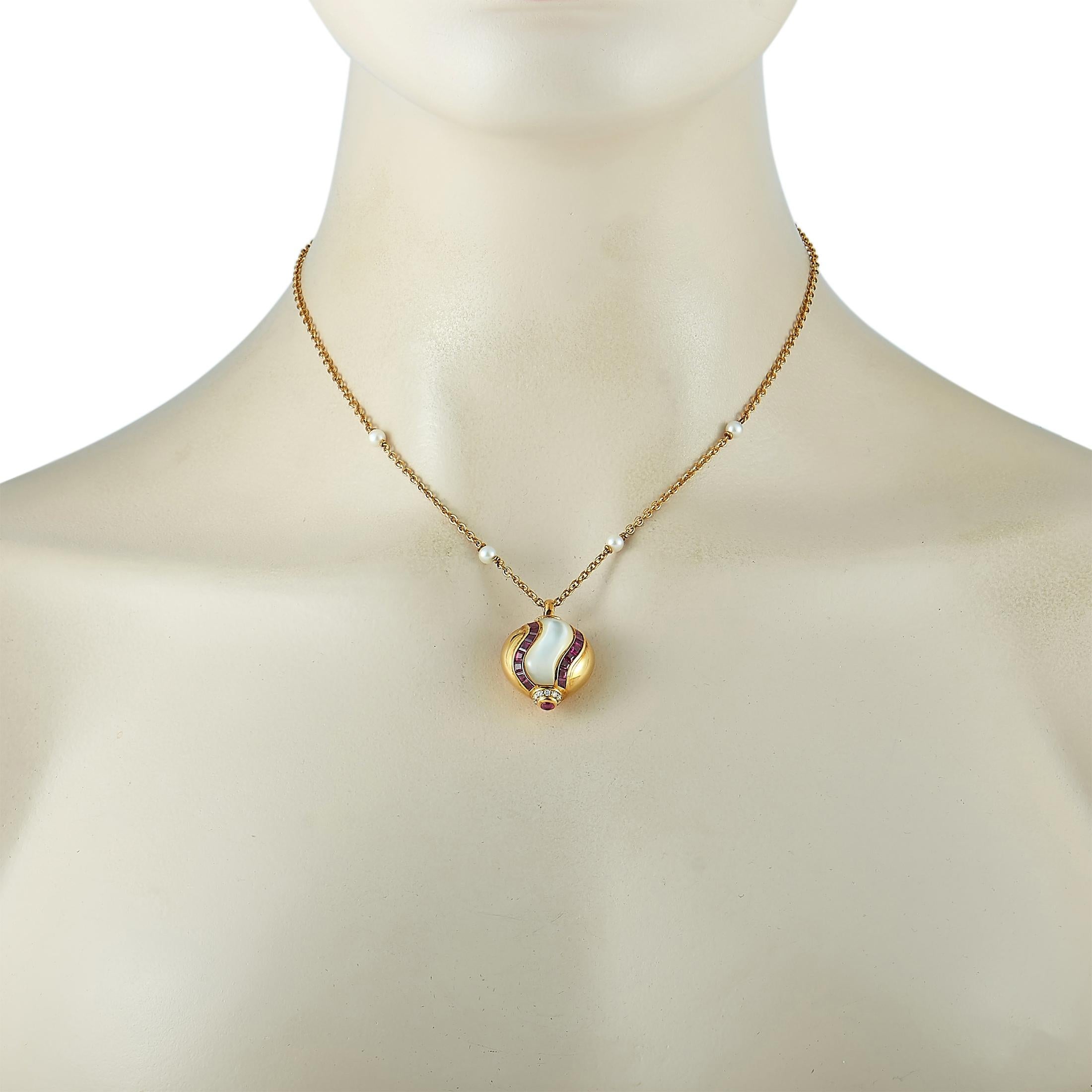 This Faraone Mennella necklace is crafted from 18K yellow gold and weighs 16 grams. It is presented with a 16” chain and a pendant that measures 1.10” in length and 0.75” in width. The necklace is embellished with pearls and with diamonds and rubies