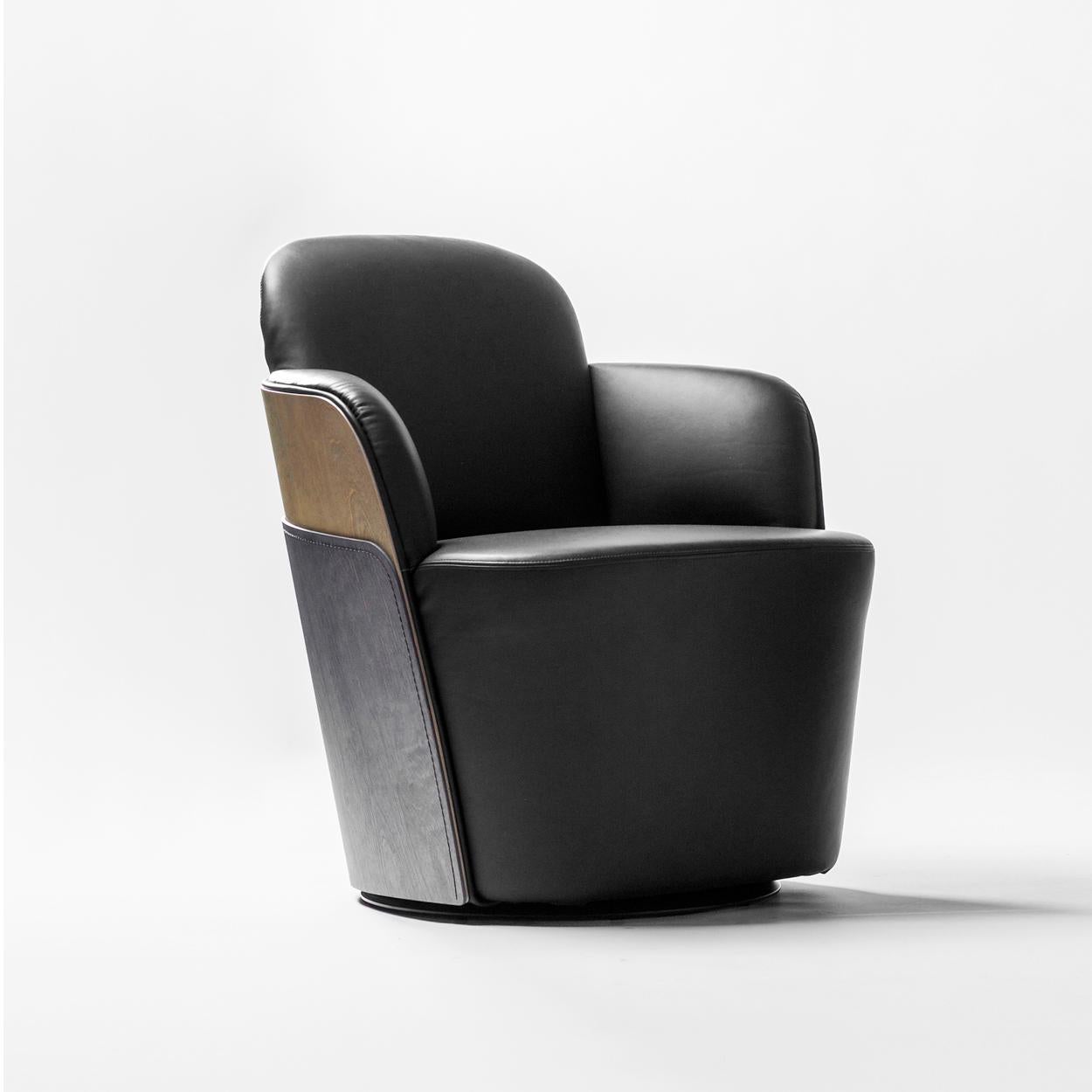 Armchair designed by Färg & Blanche manufactured by BD Barcelona

Solid wooden seat structure and upholstered. Exterior backrest made up of two birch plywood pieces sewn together and stained in a degraded color. Upholstered in leather. Optional