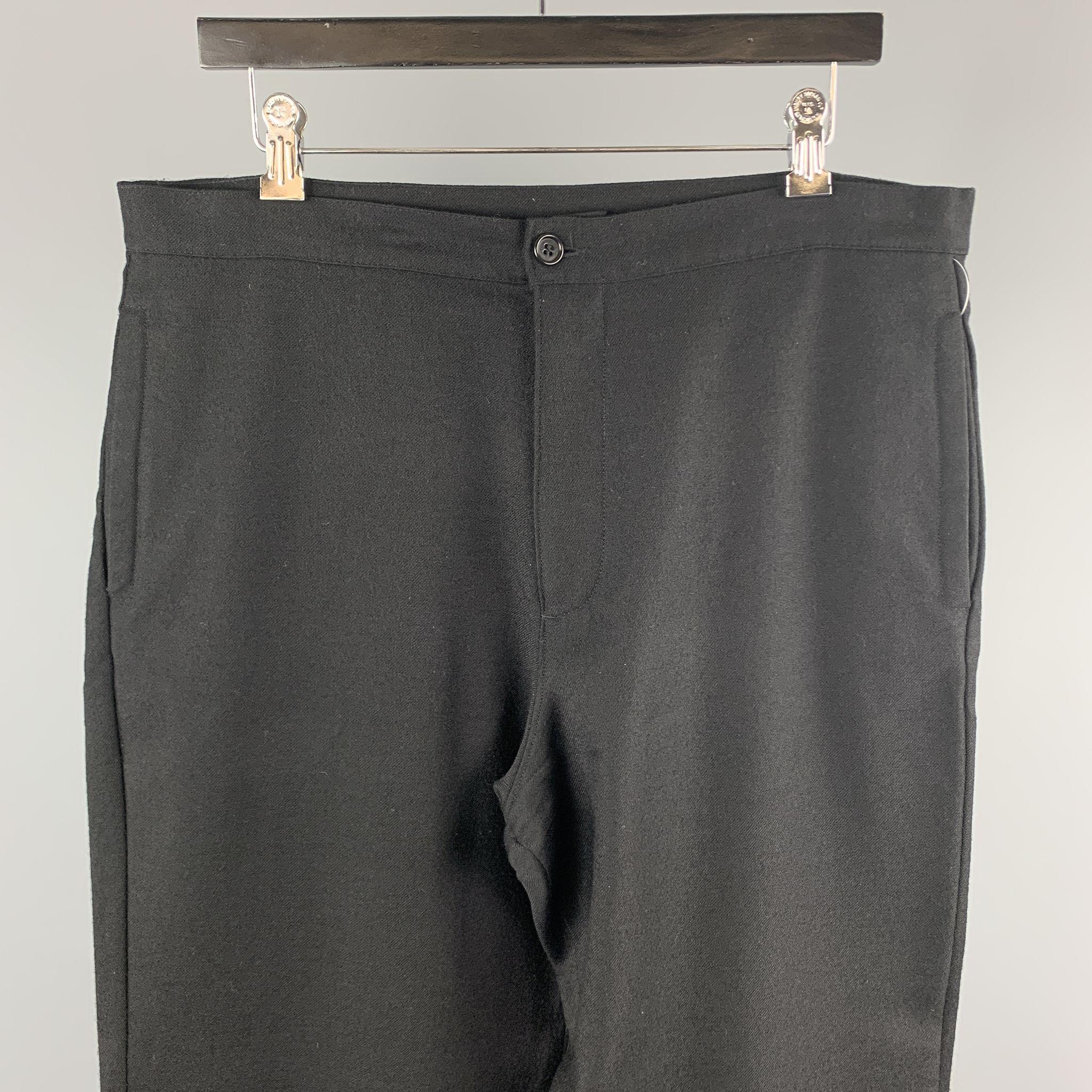 FAHRI casual pants comes in a black wool featuring a regular fit, back patch pocket, and a zip fly closure. Made in Portugal.

Excellent Pre-Owned Condition.
Marked: 34

Measurements:

Waist: 36 in. 
Rise: 13 in.
Inseam: 33 in. 

SKU:
