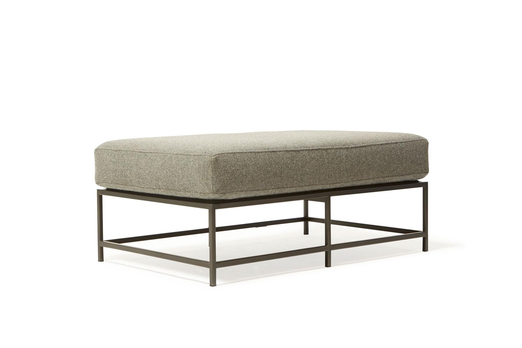 The inheritance bench is a versatile piece that can be used as a chaise extension on any sofa, as an independent seating option or as a large upholstered coffee table.

This variation is upholstered in a grey wool by Faribault Woolen Mill Co. The