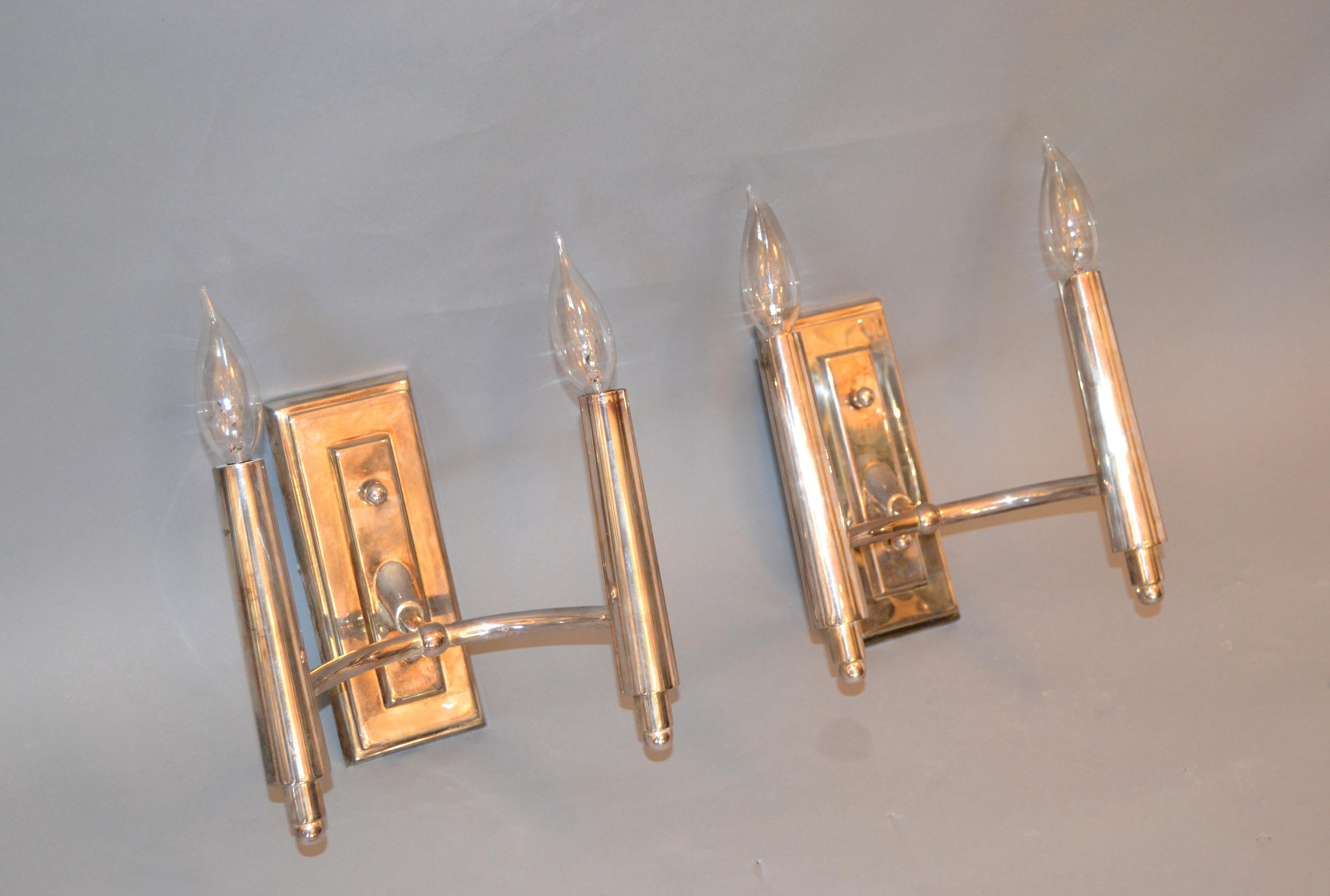 A pair of Farlane double sconces in polished silver designed by Thomas O' Brien and manufactured by Visual Comfort.
Each sconce uses 2 candelabra light bulbs with max. 40 watts.
 