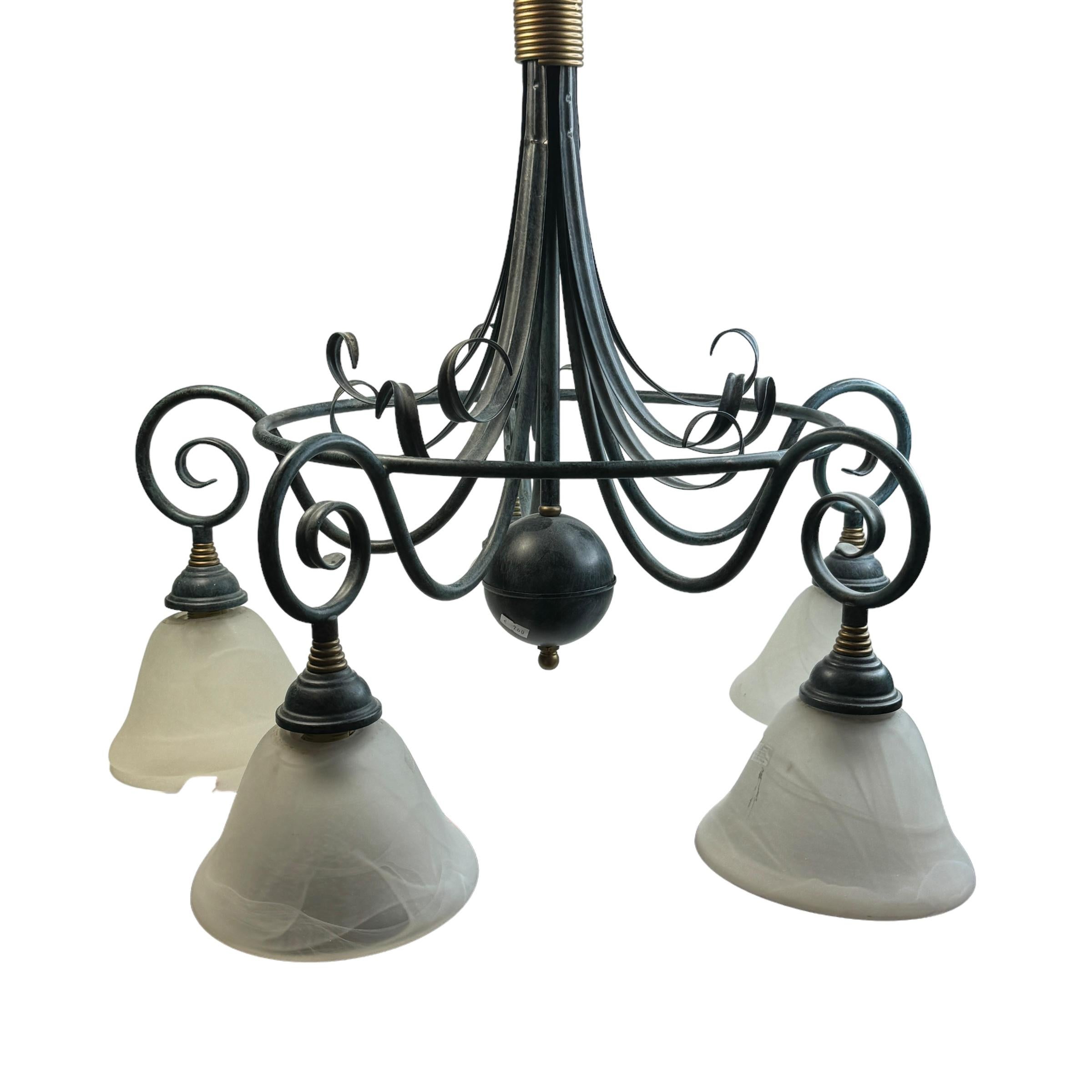 Add a touch of opulence to your home with this charming Chandelier. Perfect verdigris colored parts to enhance any chic or eclectic home. We'd love to see it hanging in an entryway or dining room as a charming welcome home. Built in the 1980s, made