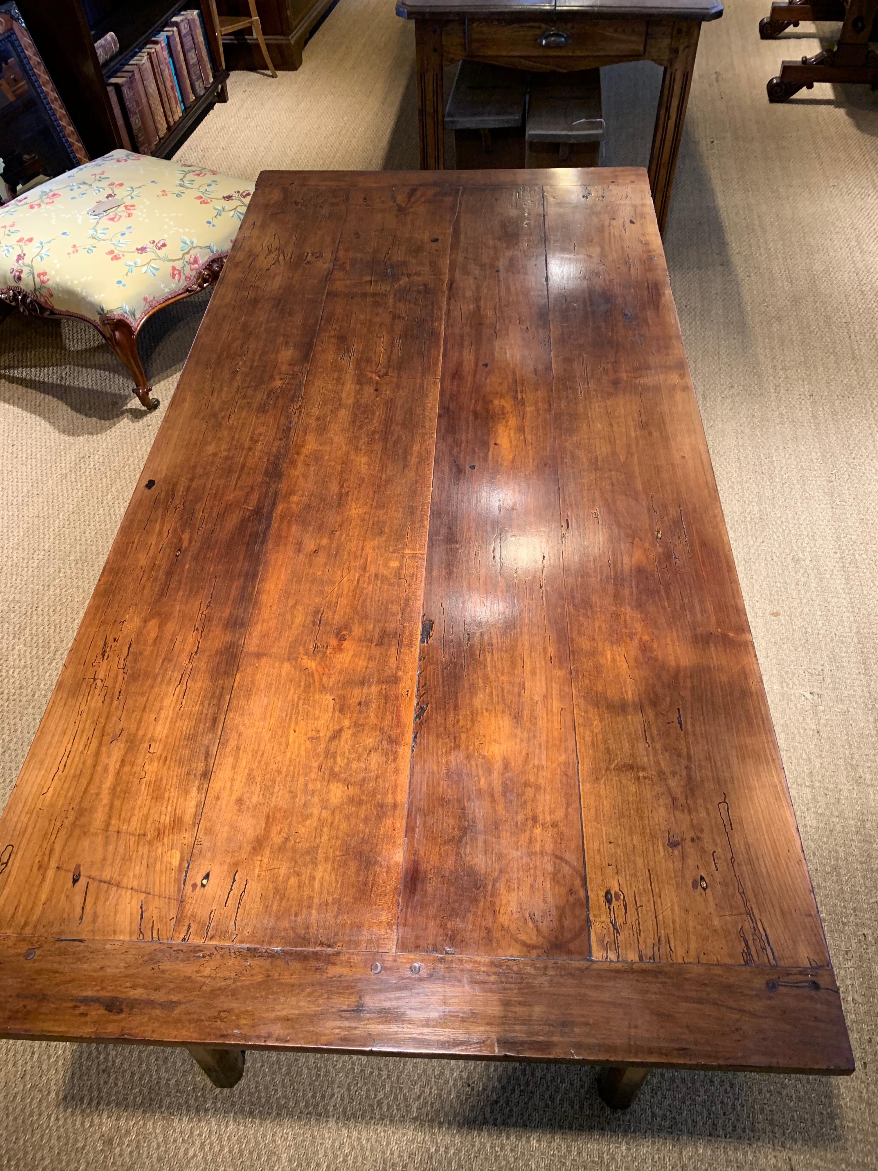 Neat sized mid-19th century cherrywood farmhouse table 

French dating to circa 1860s, drawer to end and side. Will comfortably seat 6 people 

This piece has been through our workshops, cleaned / polished and checked over any woodworm has been