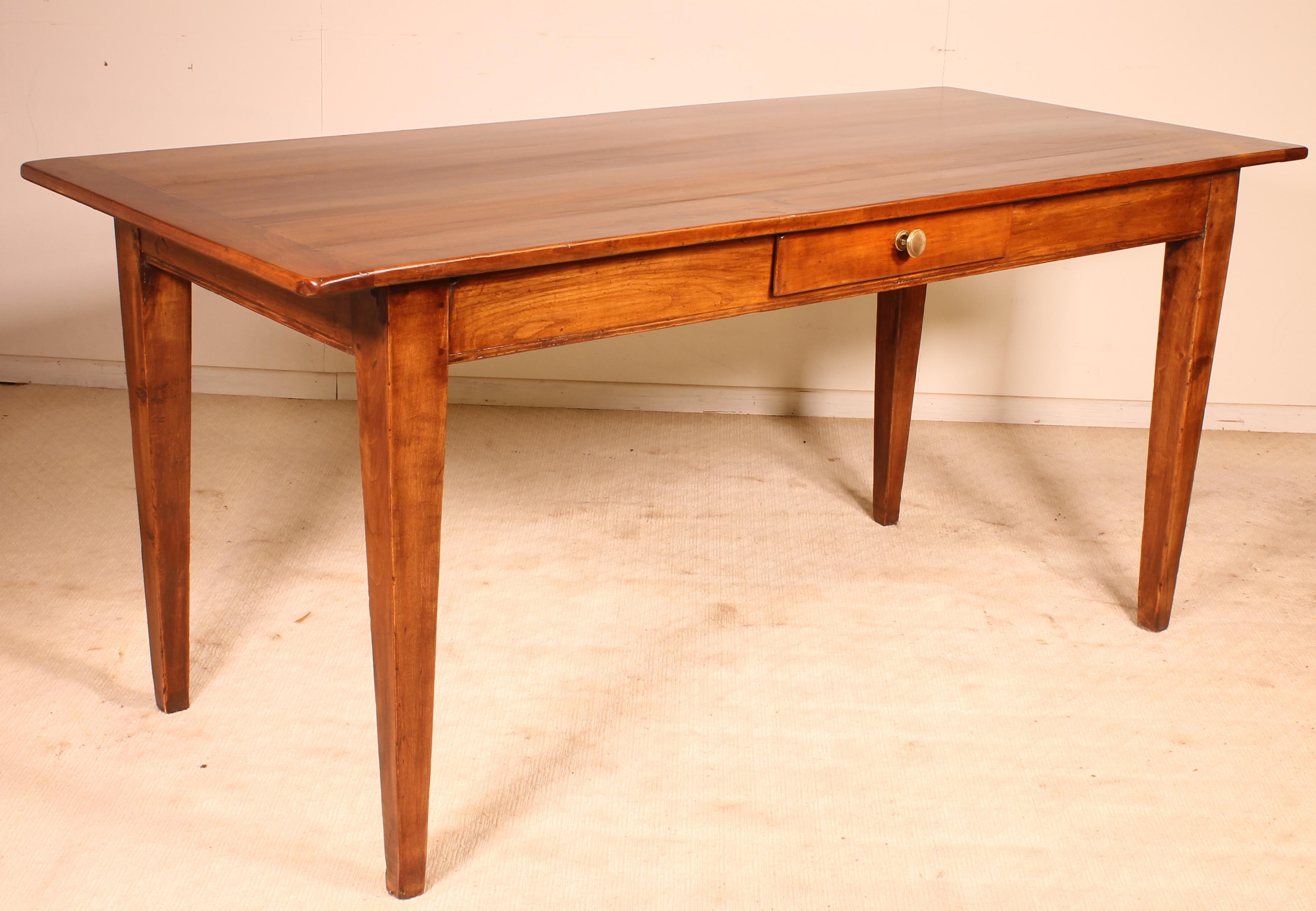 Fine 19th century French farmhouse table in wild cherrywood 
Beautiful table with superb proportions and with Louis XVI style square feets 

Drawer in its belt and beautiful tabletop with a width of 75cm good height under the belt of