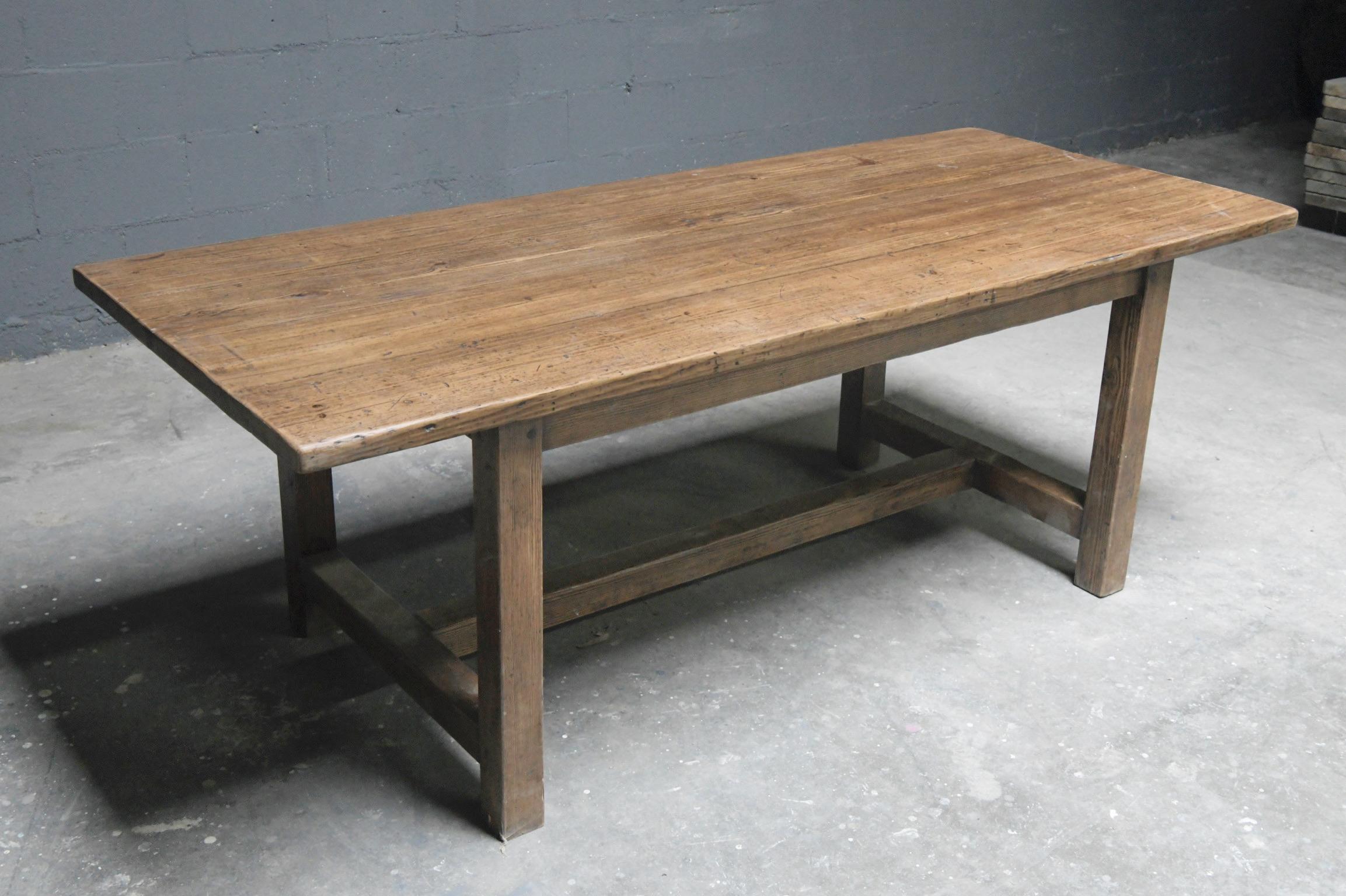 This reclaimed pine farm table is seen here in 110