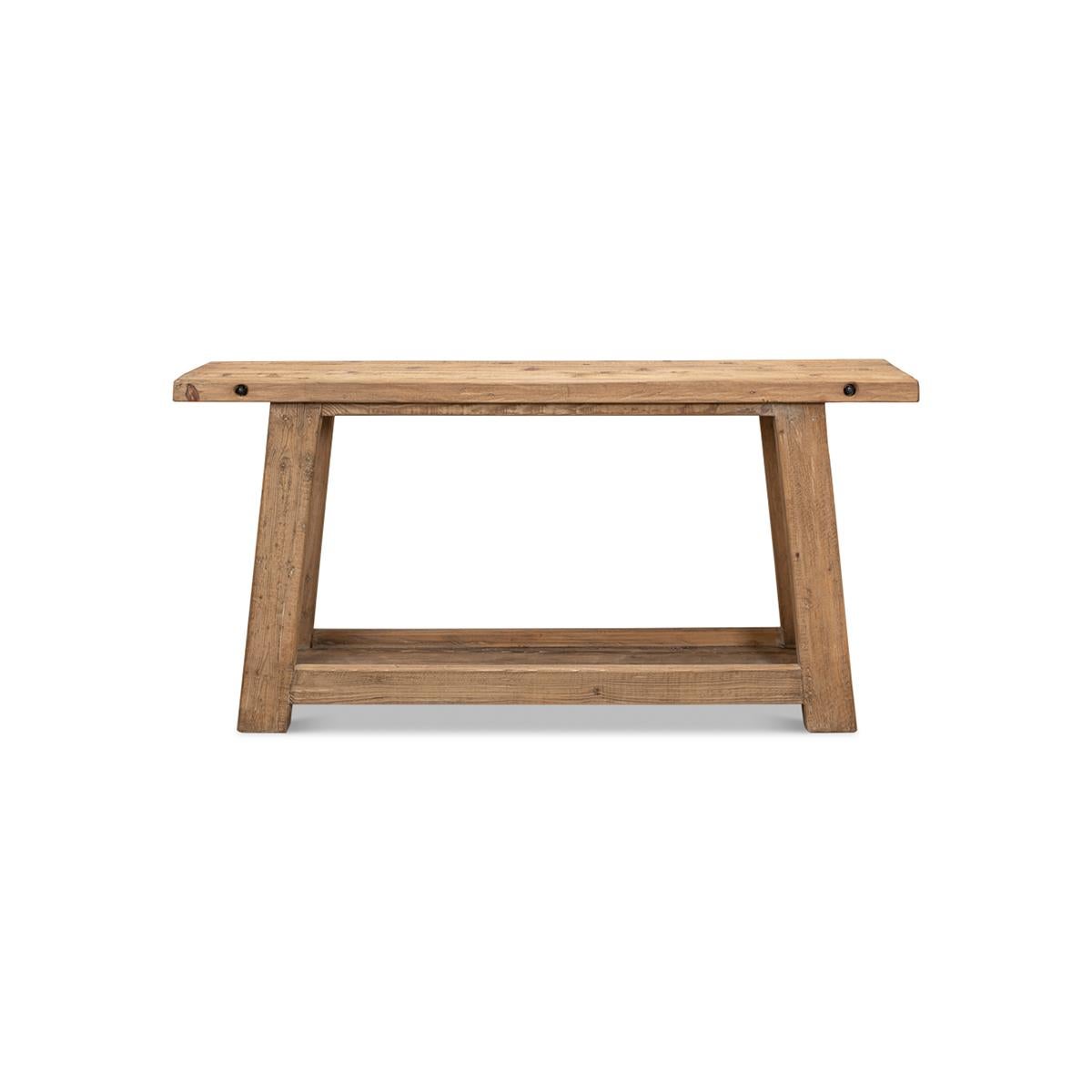 Farmhouse Console is made with reclaimed solid pine in a natural finish. The planked top is raised on an angled four-leg base with a shelf stretcher.

Dimensions: 68