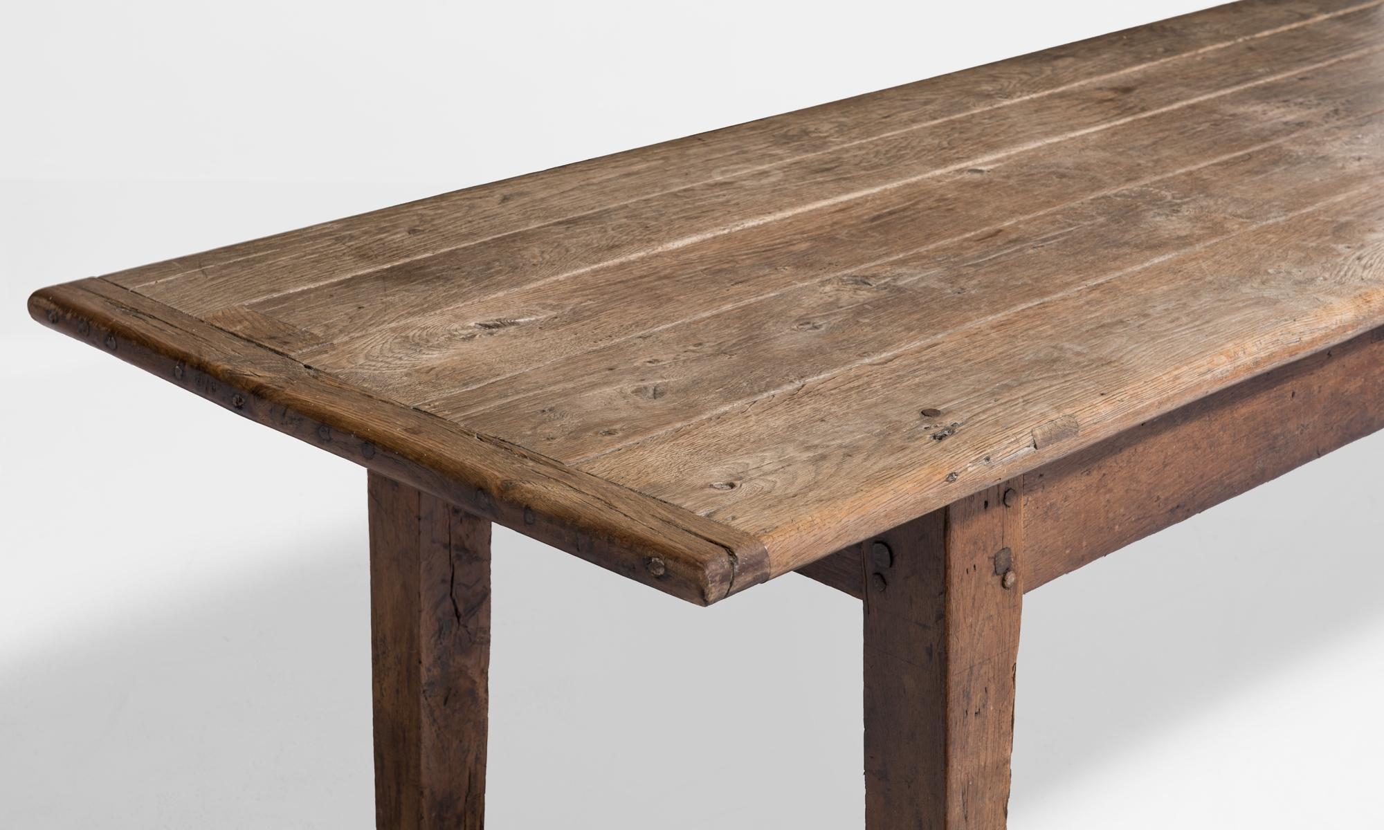 Solid oak table with rectangular plank top. Amazing patina.
England, circa 1750.