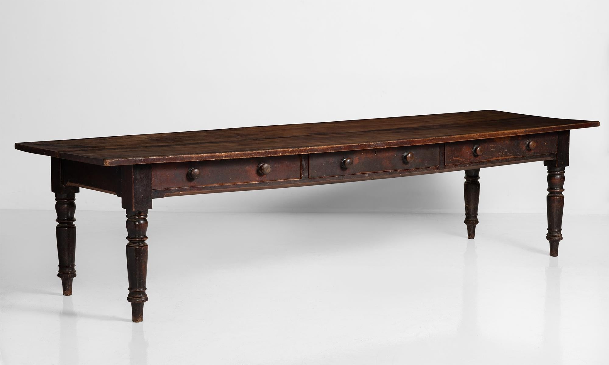 Farmhouse dining table, England, circa 1830.

Original black paint on birch base with twin plank double sided top.