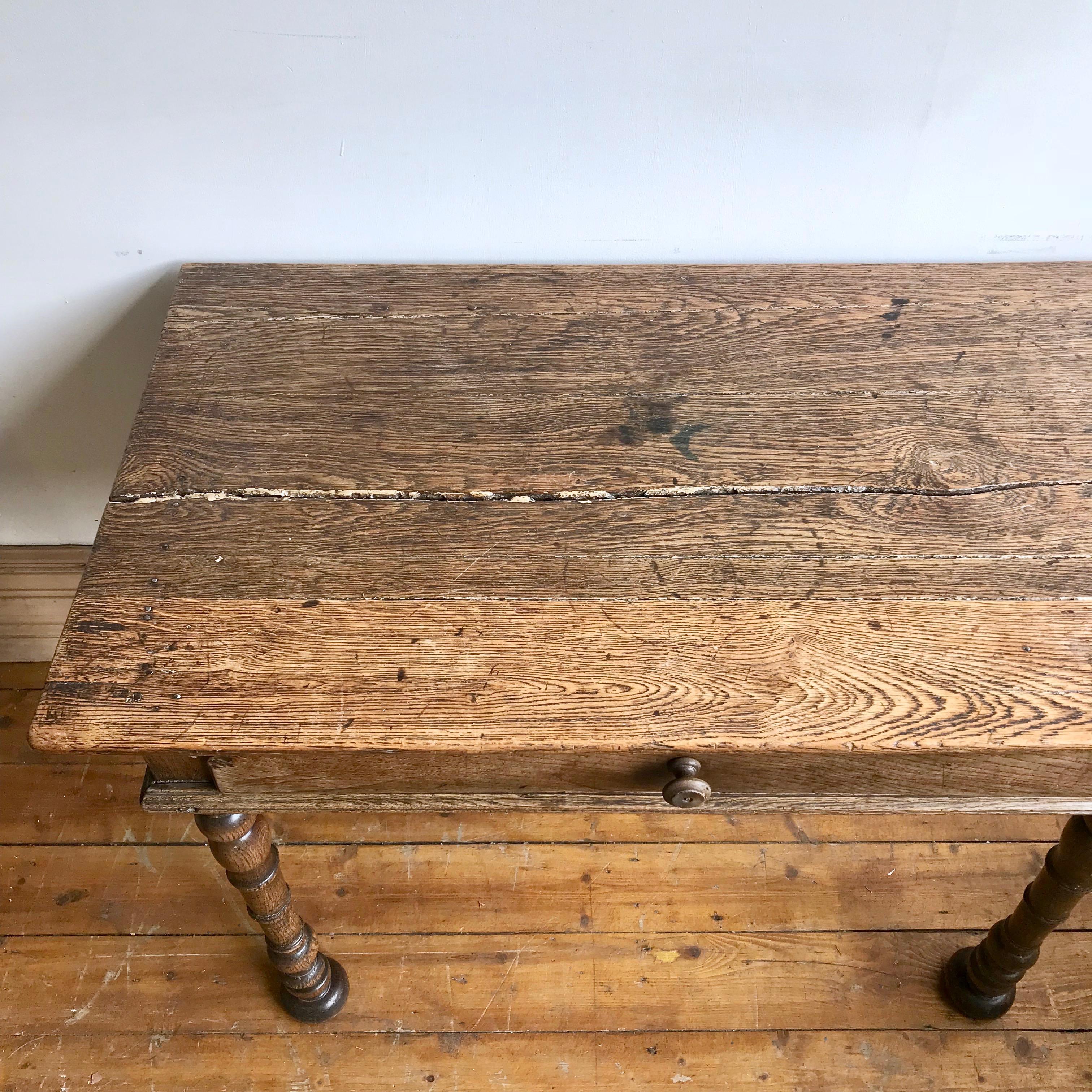 English farmhouse table with drawer. This late 1800s farmhouse table with a sectioned drawer could be used as a desk or a side table.